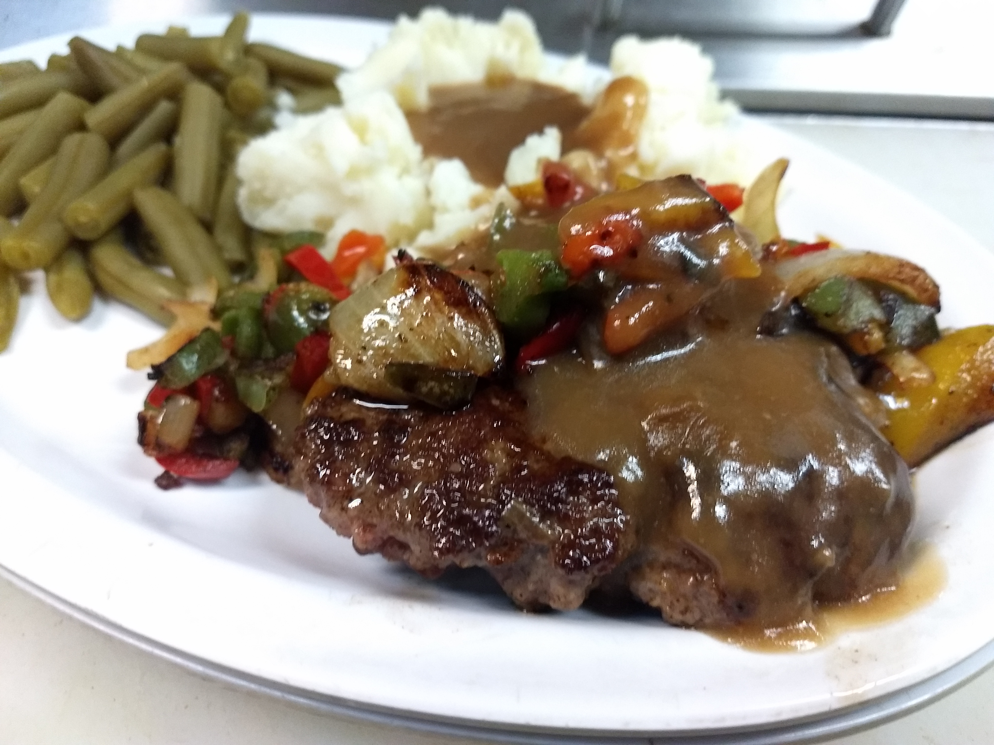 Order Hamburger Steak w/ 2 sides food online from Breakers Sports Grill store, Henrico on bringmethat.com
