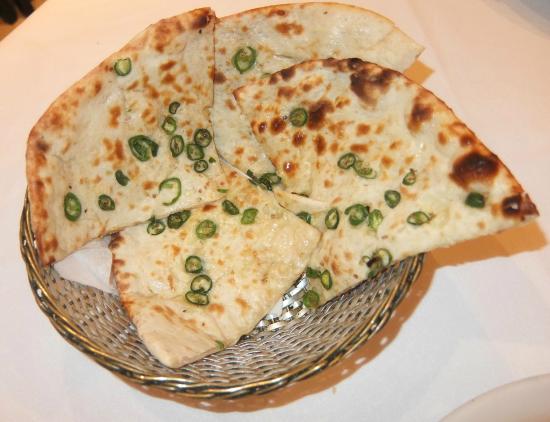 Order Chili Naan food online from India's Grill store, Los Angeles on bringmethat.com