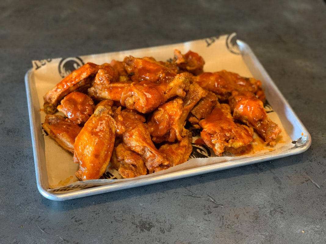 Order 10 Bone-in Wings food online from East Coast Wings + Grill store, High Point on bringmethat.com