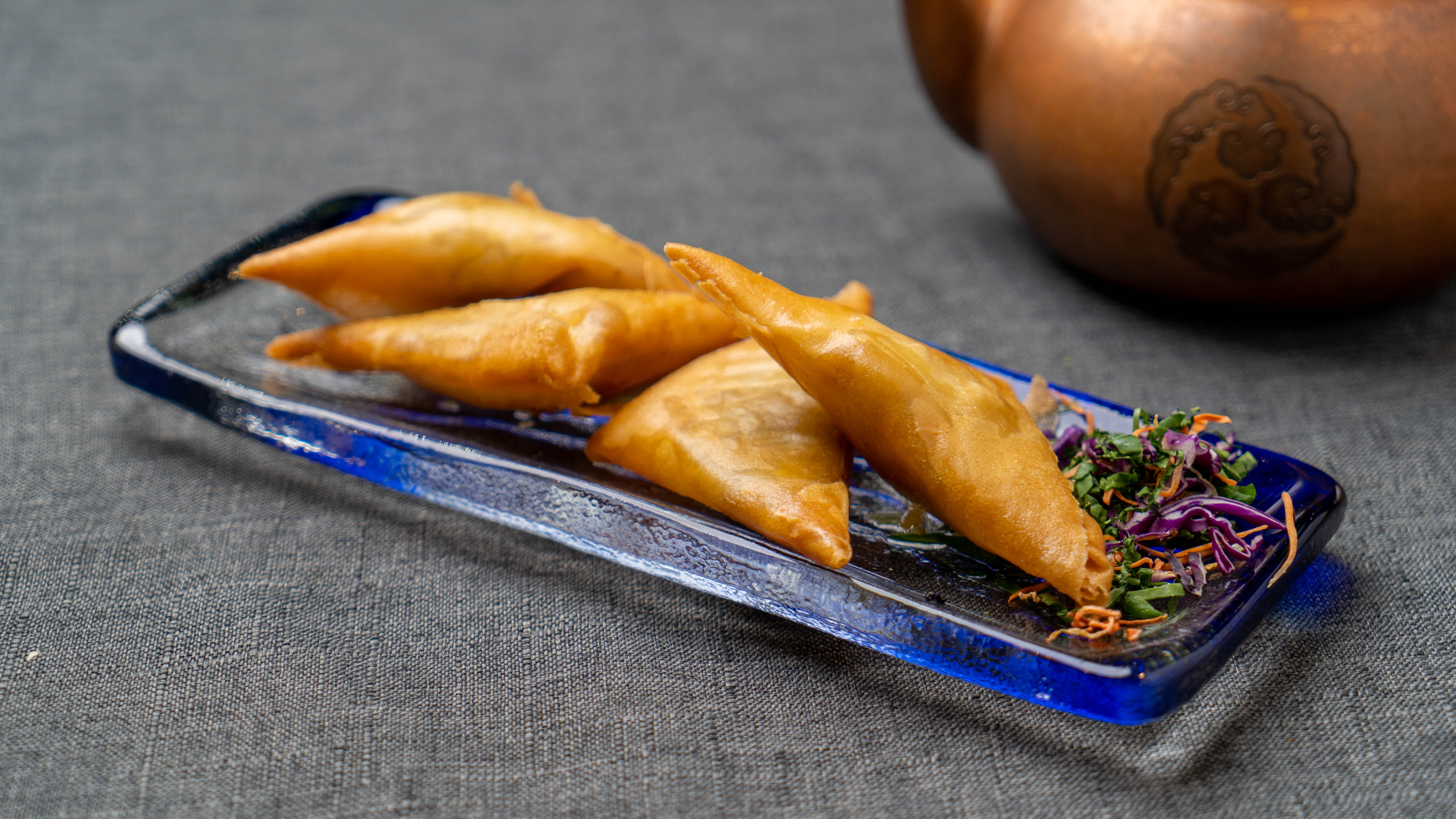 Order Curry Fish Samosa (4)  food online from Osmanthus Dim Sum Lounge store, San Francisco on bringmethat.com