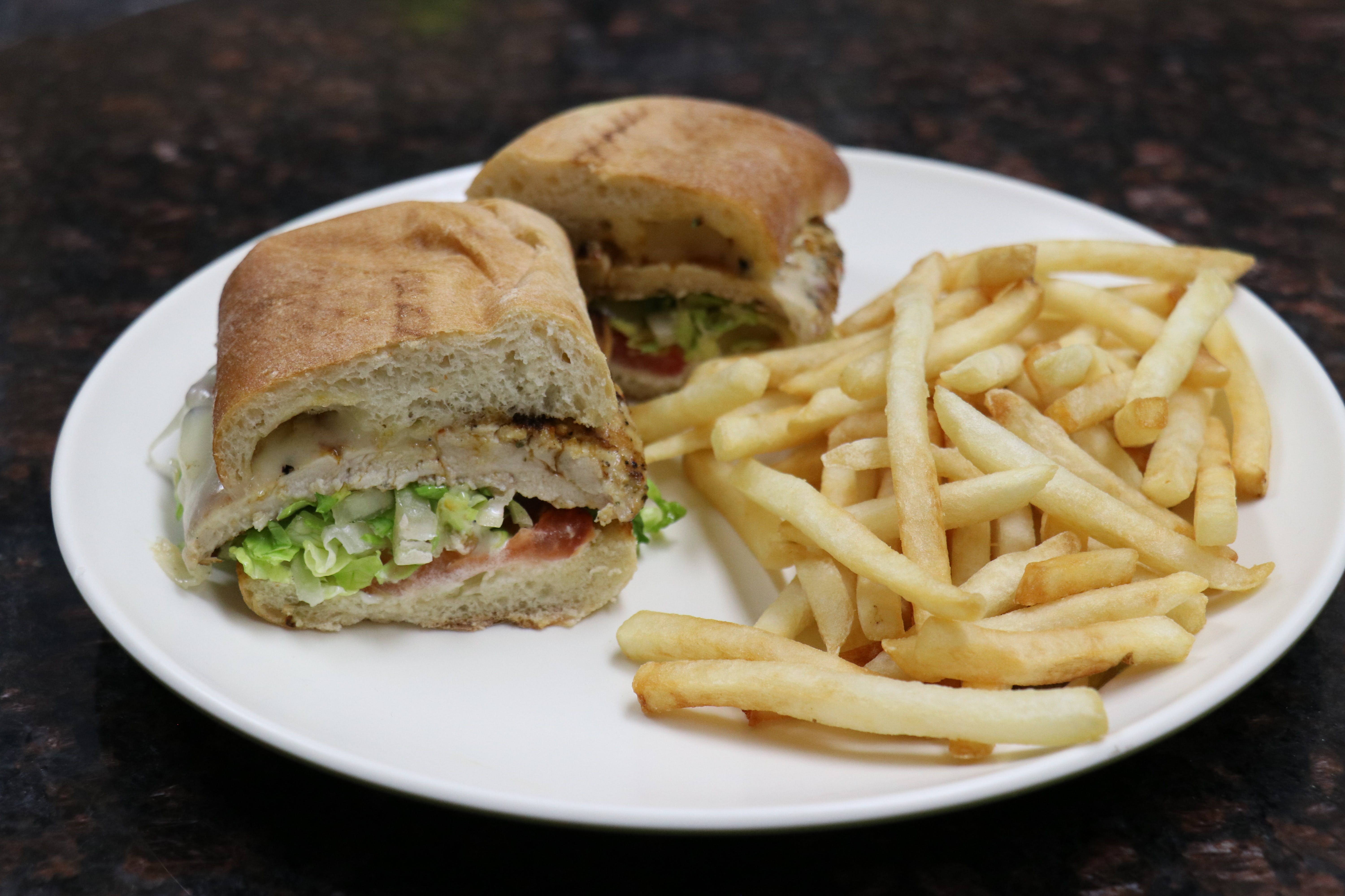 Order Rosemary Grilled Chicken Sandwich - Sandwich food online from The Village Grille store, Great Falls on bringmethat.com