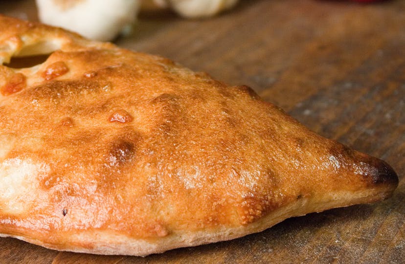 Order Traditional Calzone - Calzone food online from NYPD Pizza store, Orlando on bringmethat.com