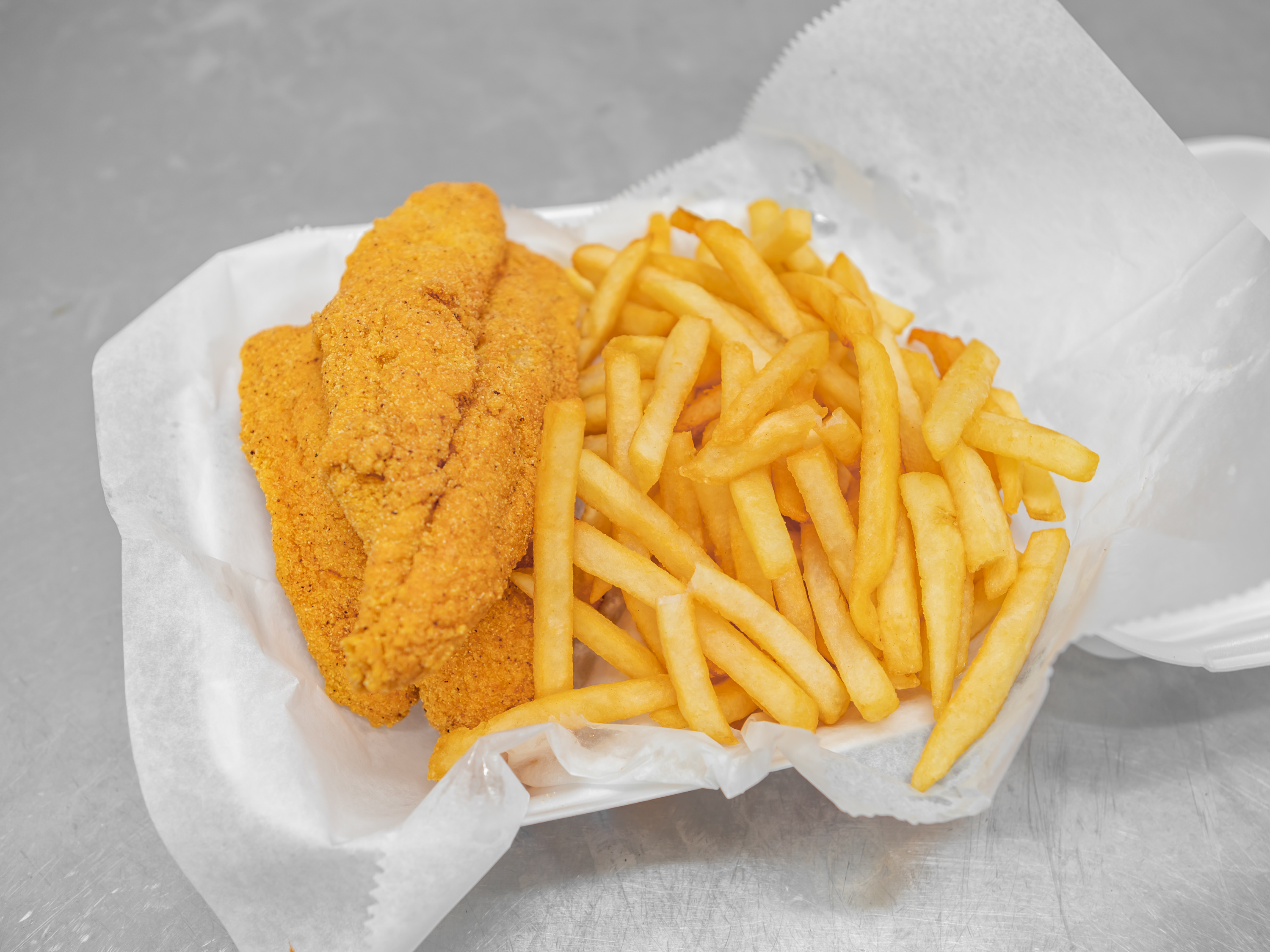 Order 9. Catfish Fillet Dinner food online from Pops Fish & Chicken Market store, Fairview Heights on bringmethat.com