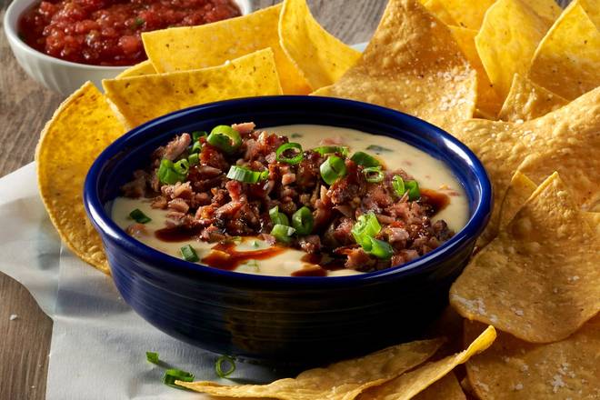 Order New! Brisket Queso food online from Cotton Patch Cafe store, Grapevine on bringmethat.com