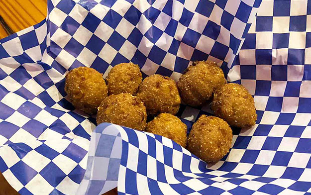 Order 8 Piece Hush Puppies food online from Cajun Crab store, Irving on bringmethat.com