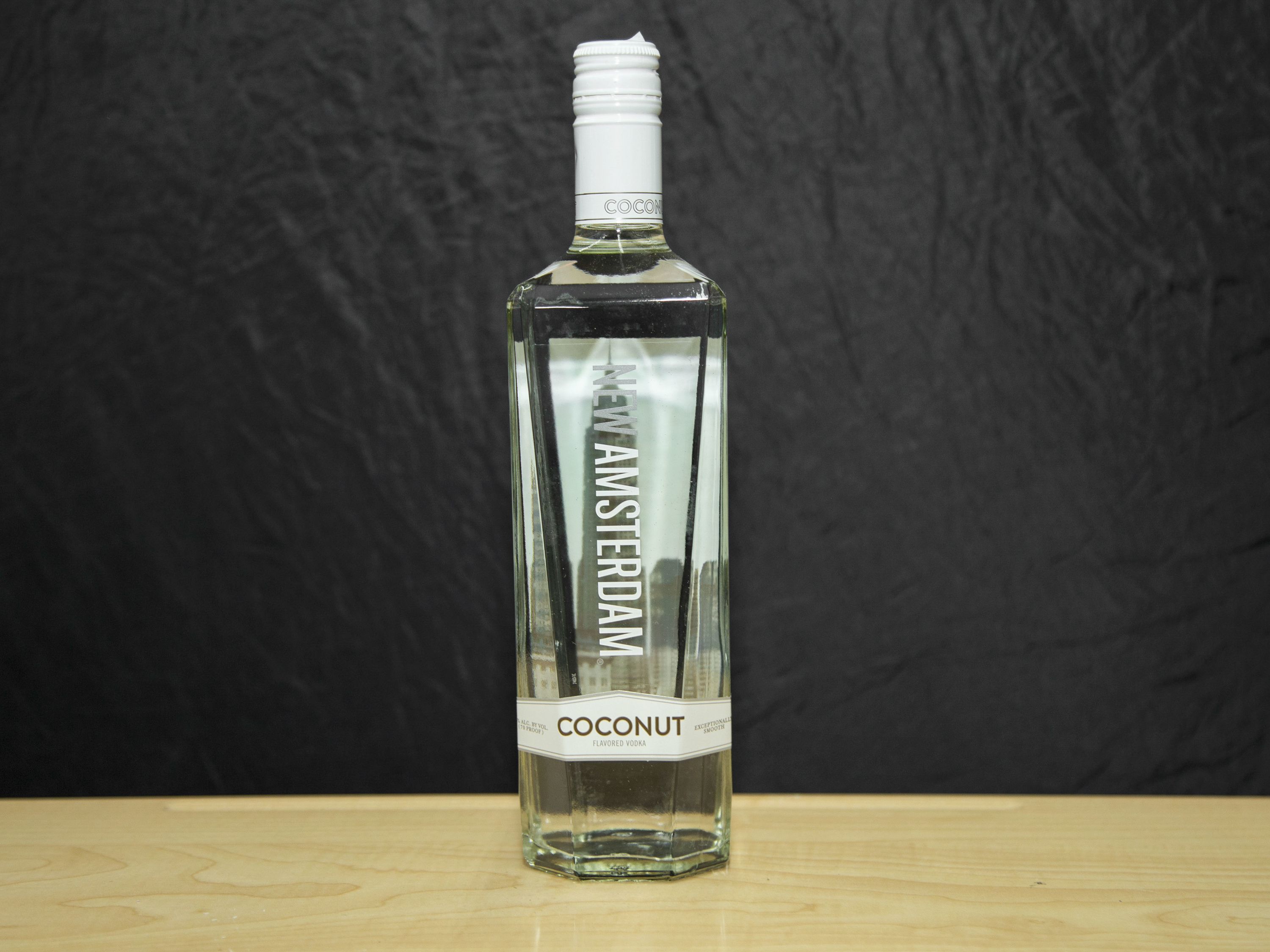 Order New Amsterdam Coconut Flavored, 750 ml. Vodka (35.0% ABV) food online from Platinum Star Food & Liquor store, Chicago on bringmethat.com