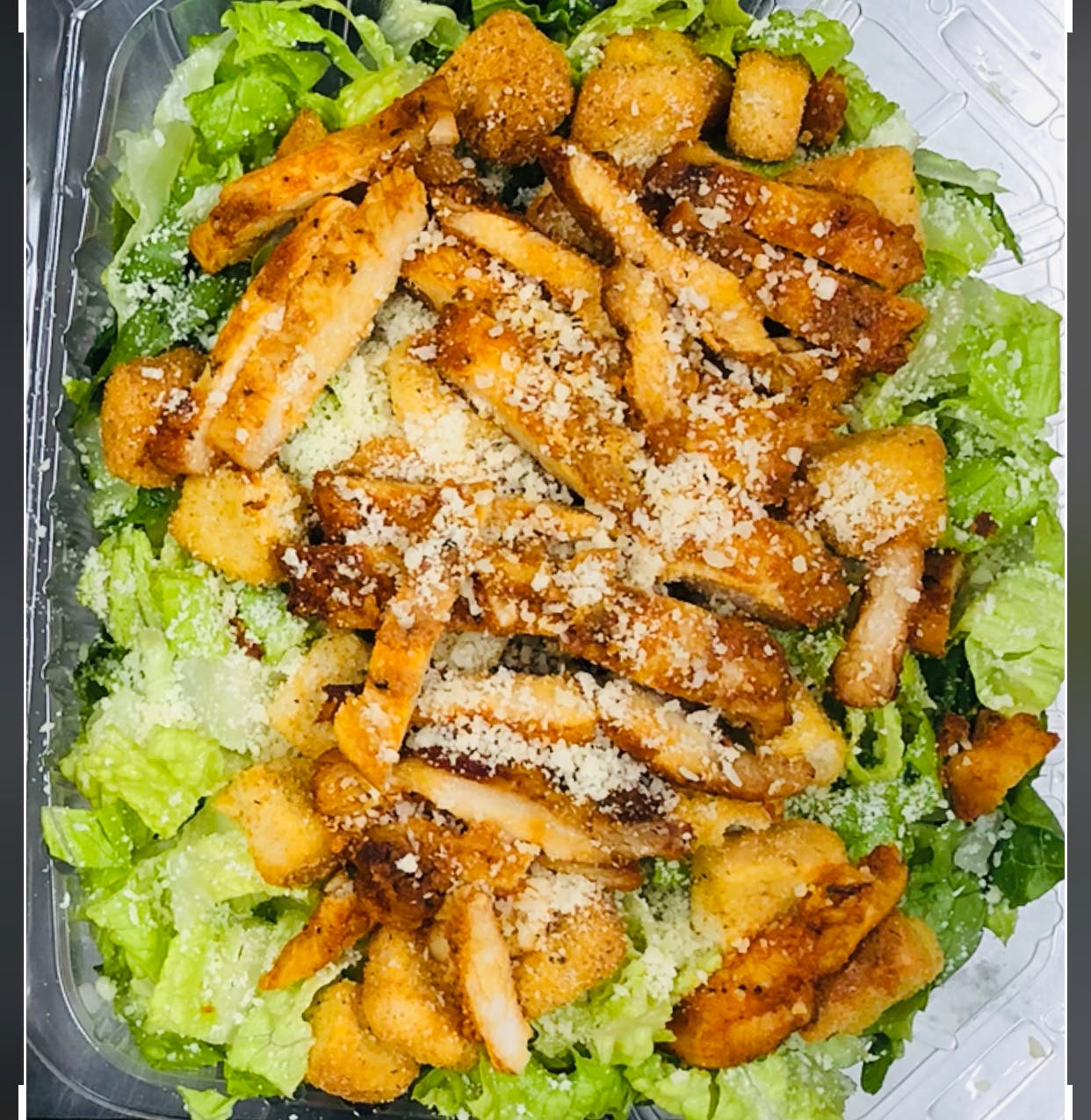 Order Chicken Caesar Salad - Chicken Caesar Salad food online from Oros Pizza & Bakery store, Van Nuys on bringmethat.com