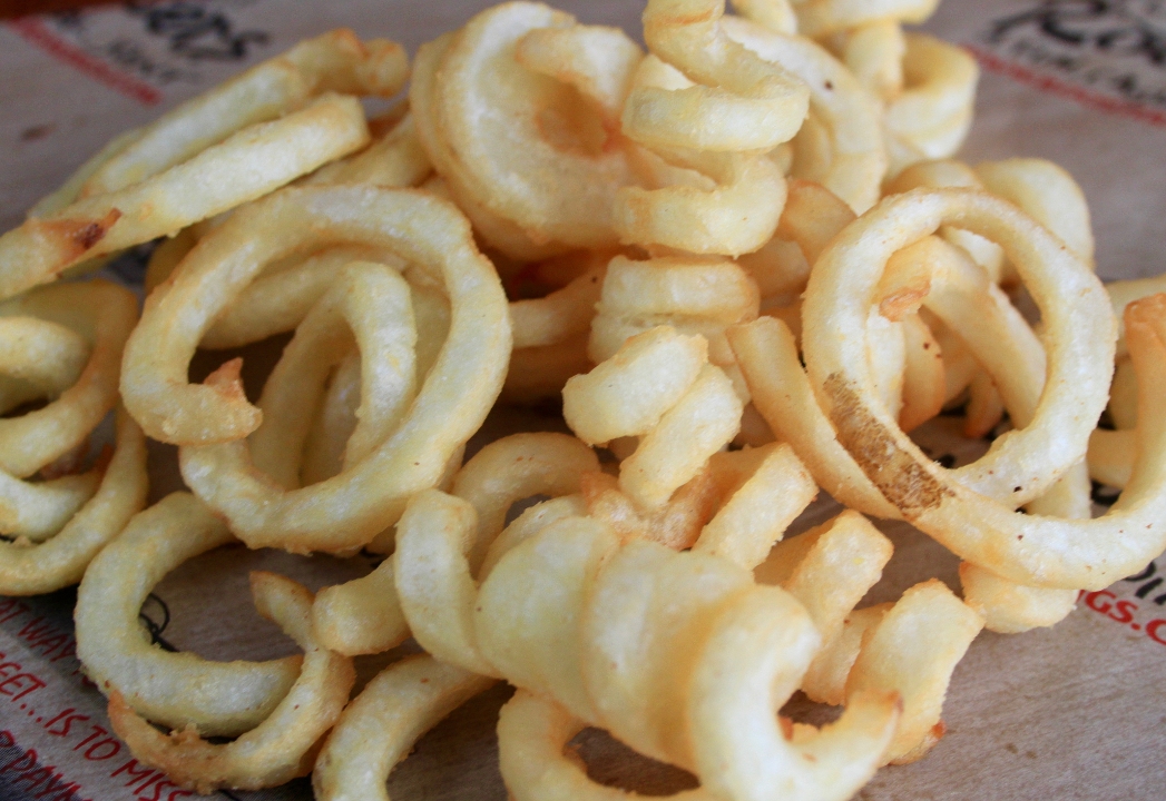 Order Curly Fries * food online from Roosters store, Huntington on bringmethat.com