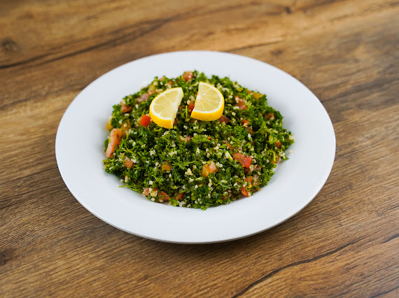 Order Tabouli Salad food online from Dimassi's Mediterranean Buffet store, The Woodlands on bringmethat.com