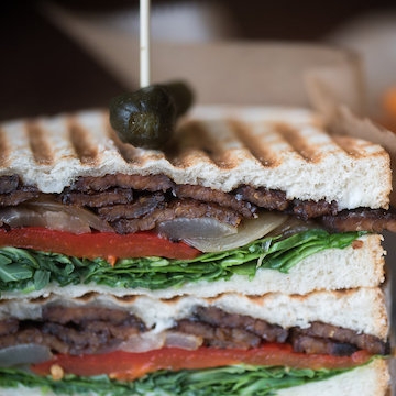 Order Tempeh Panini food online from Busboys and Poets store, Washington on bringmethat.com