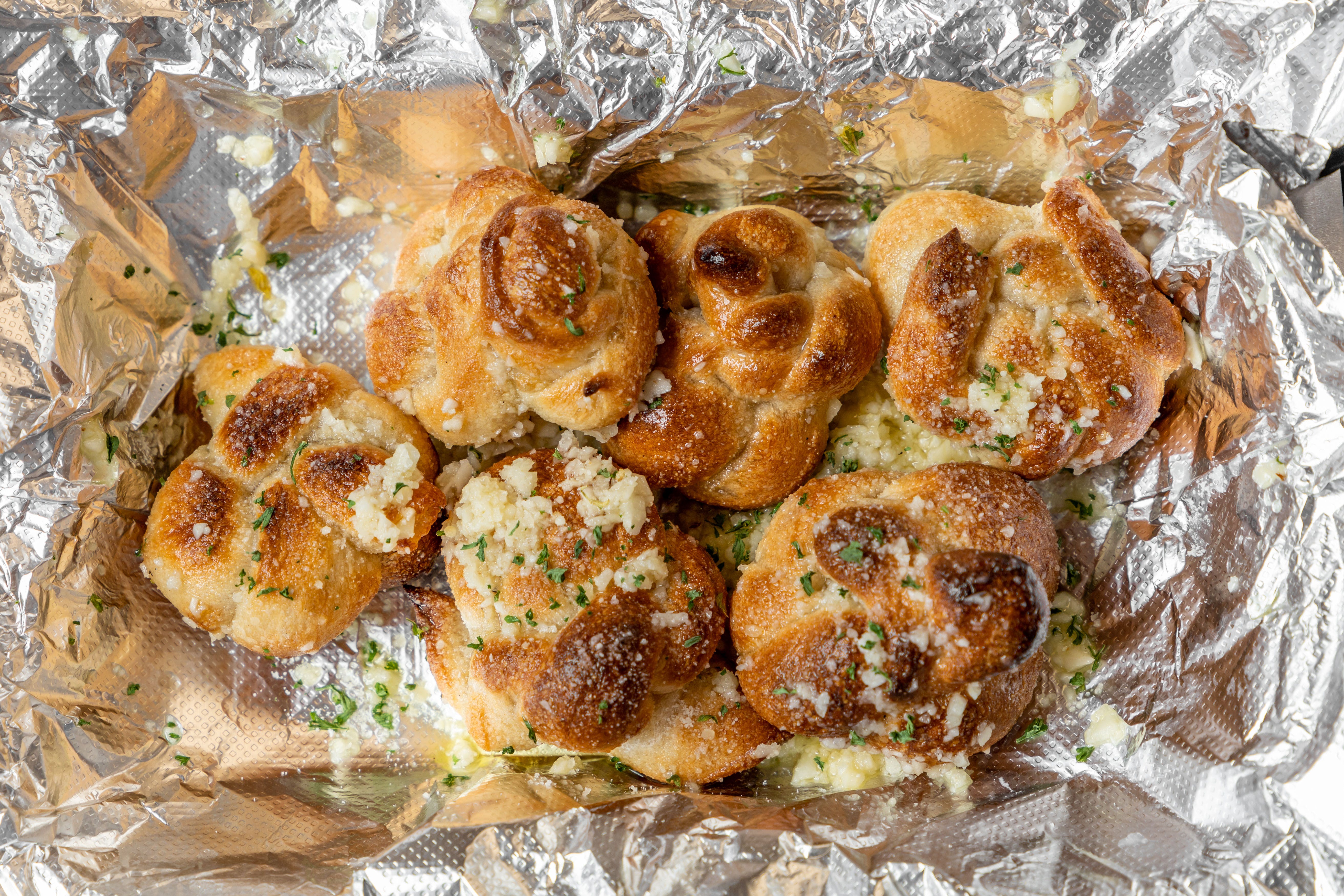 Order Garlic Knots - 6 Pieces food online from Mingaliens Trattoria store, Natick on bringmethat.com