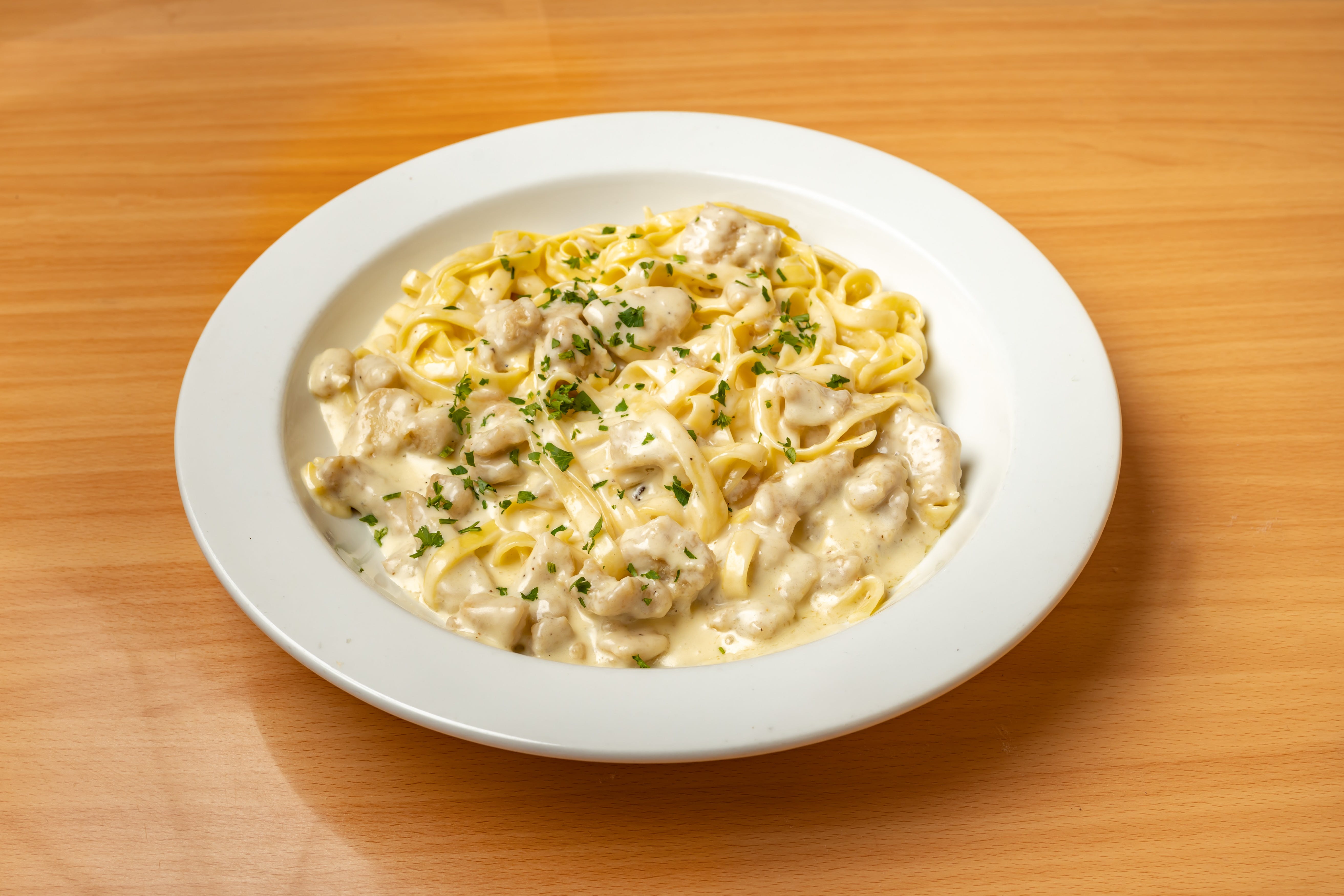 Order Fettuccine Alfredo with Chicken - Pasta food online from Valentino's store, Fresh Meadows on bringmethat.com