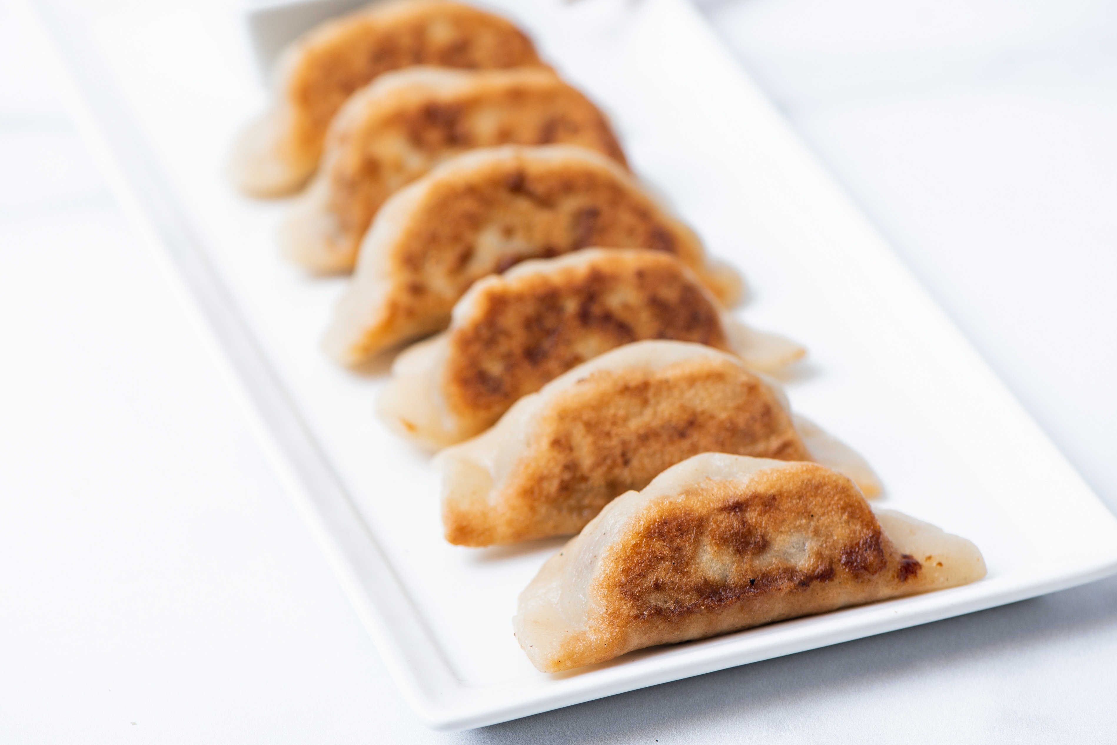 Order Sweet Potato Potstickers food online from Ginger Bowls store, San Francisco on bringmethat.com