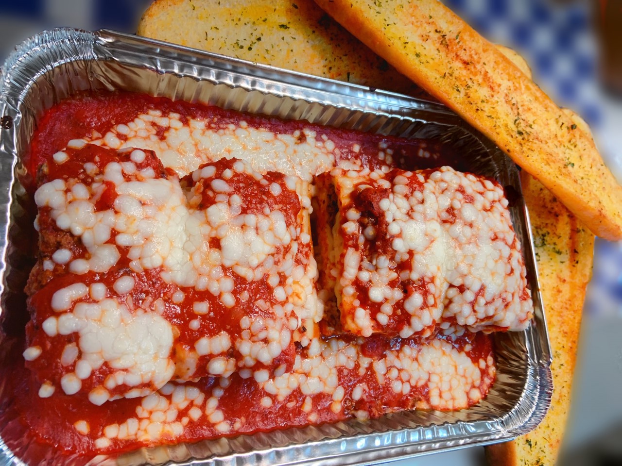 Order Family Homemade Lasagna food online from Village Pizza & Seafood store, Santa Fe on bringmethat.com