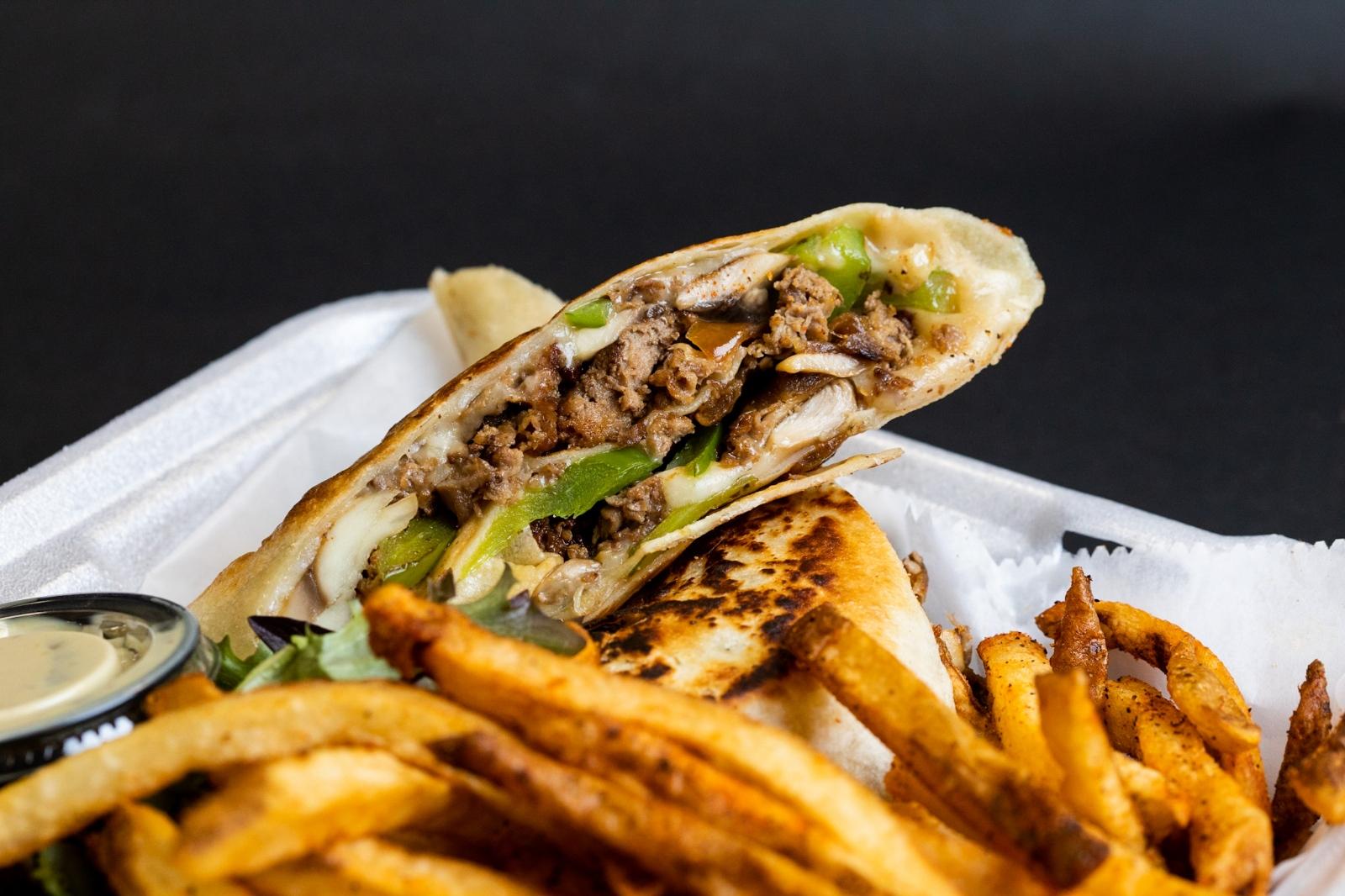 Order Ollie's Philly Steak Wrap food online from Ridiculous Eatz store, Columbus on bringmethat.com