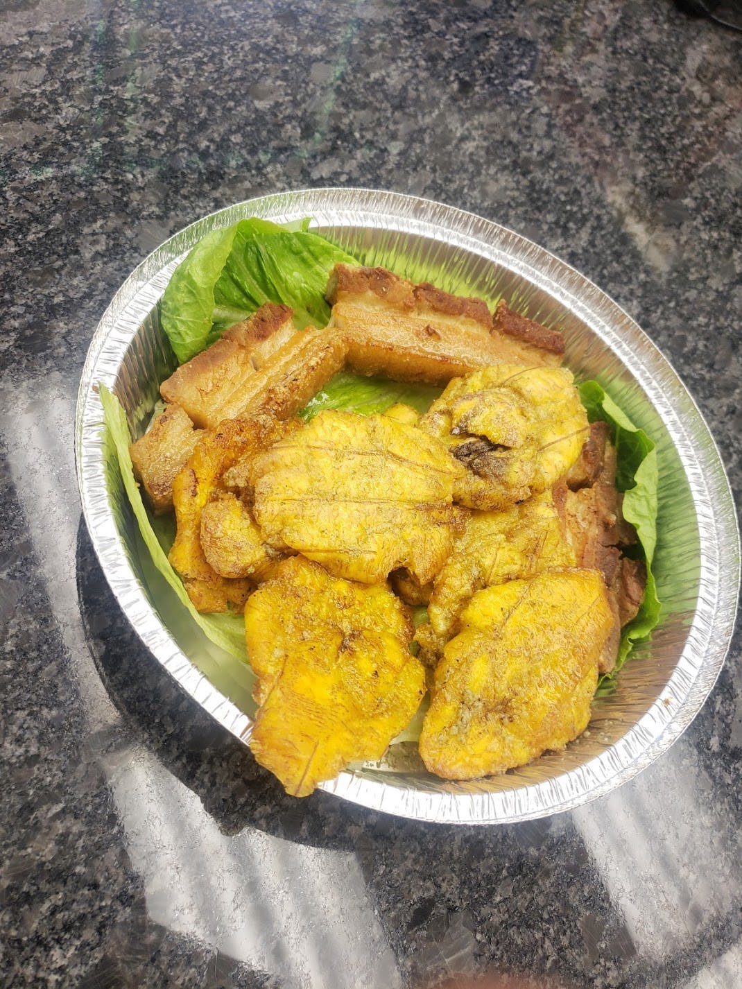 Order Fried Pork with Fried Plantain - Platter food online from Amigos Restaurant & Pizza store, Cheltenham on bringmethat.com