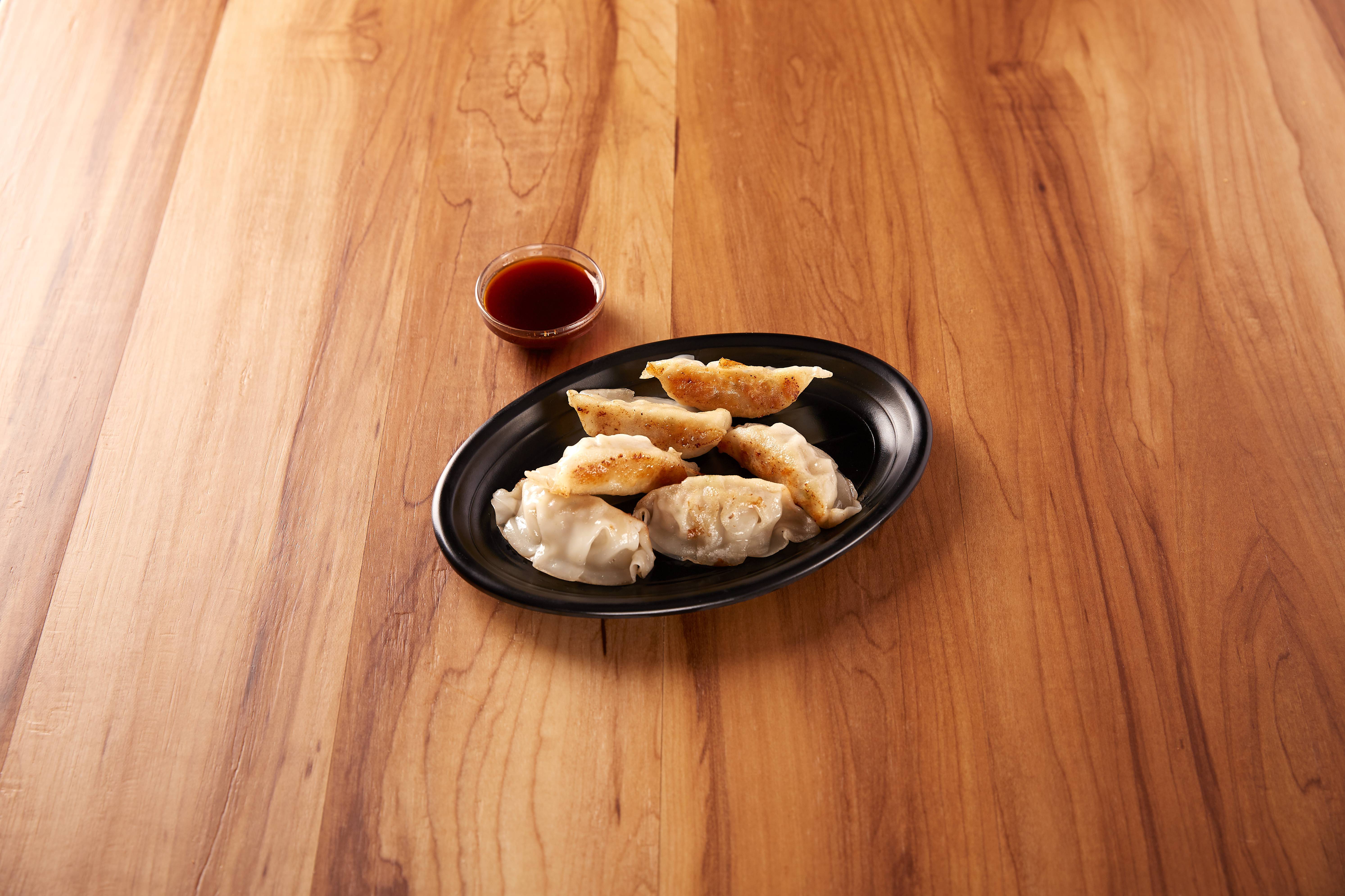 Order 6 Pieces Pork Gyoza food online from Volcano Sushi and China Bistro store, Norfolk on bringmethat.com