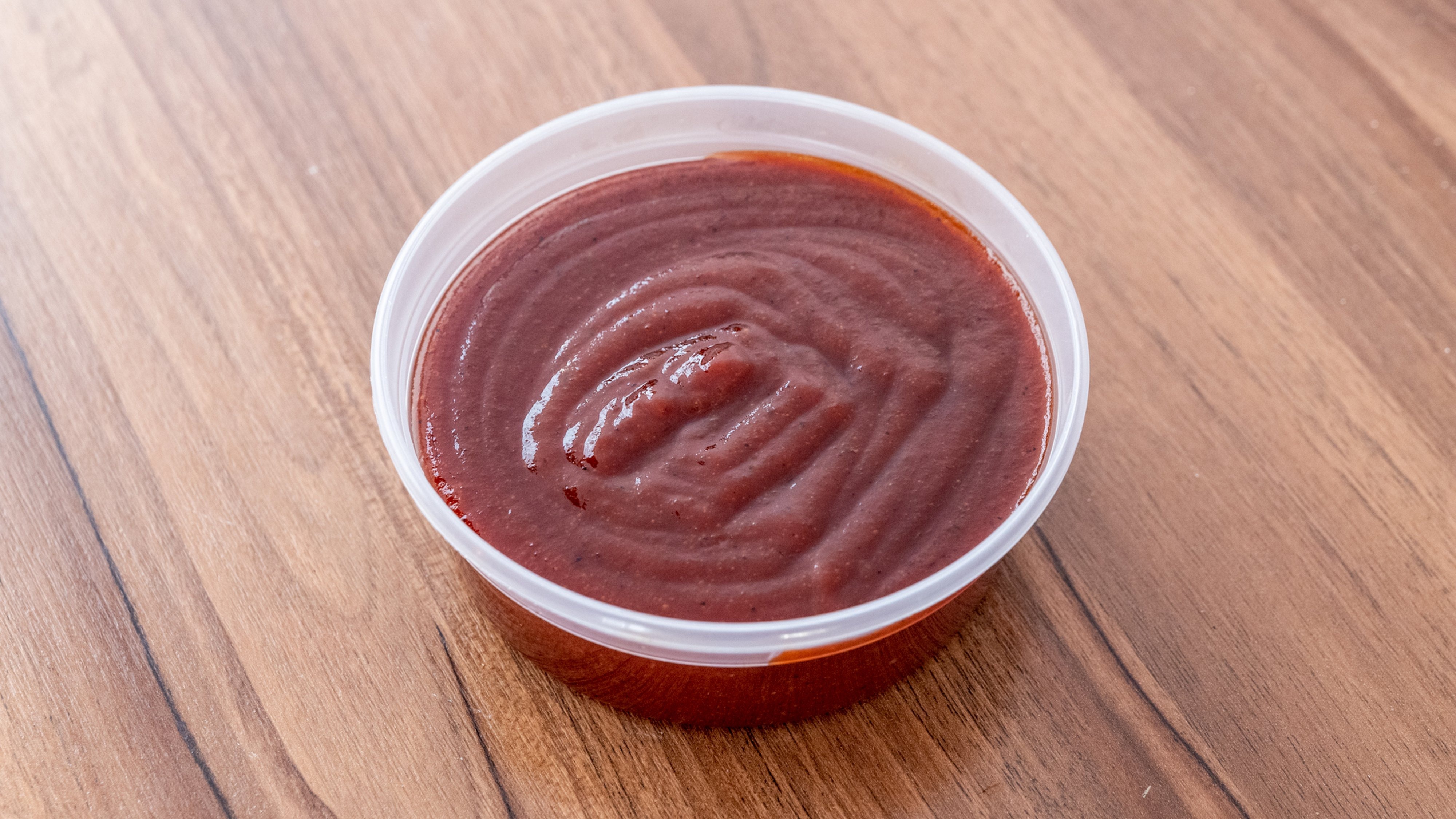 Order Side of BBQ Sauce - 2 oz food online from Captain Jay Fish & Chicken store, Southfield on bringmethat.com