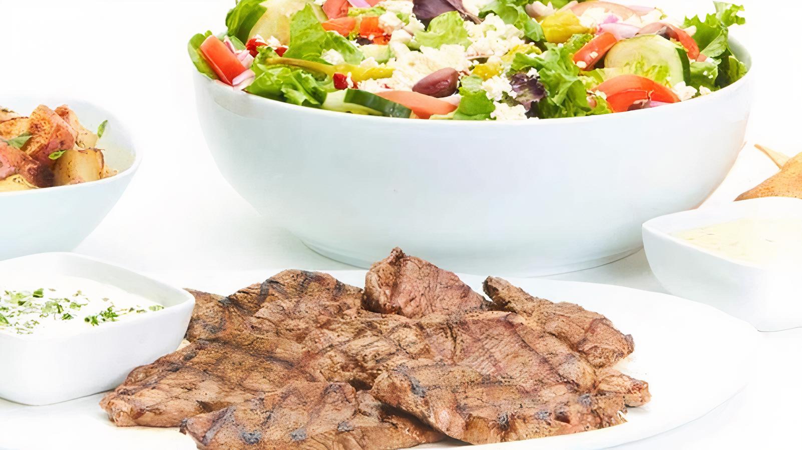 Order Chargrilled Lamb Family Feast for 6 food online from Taziki Mediterranean Cafe store, Alpharetta on bringmethat.com
