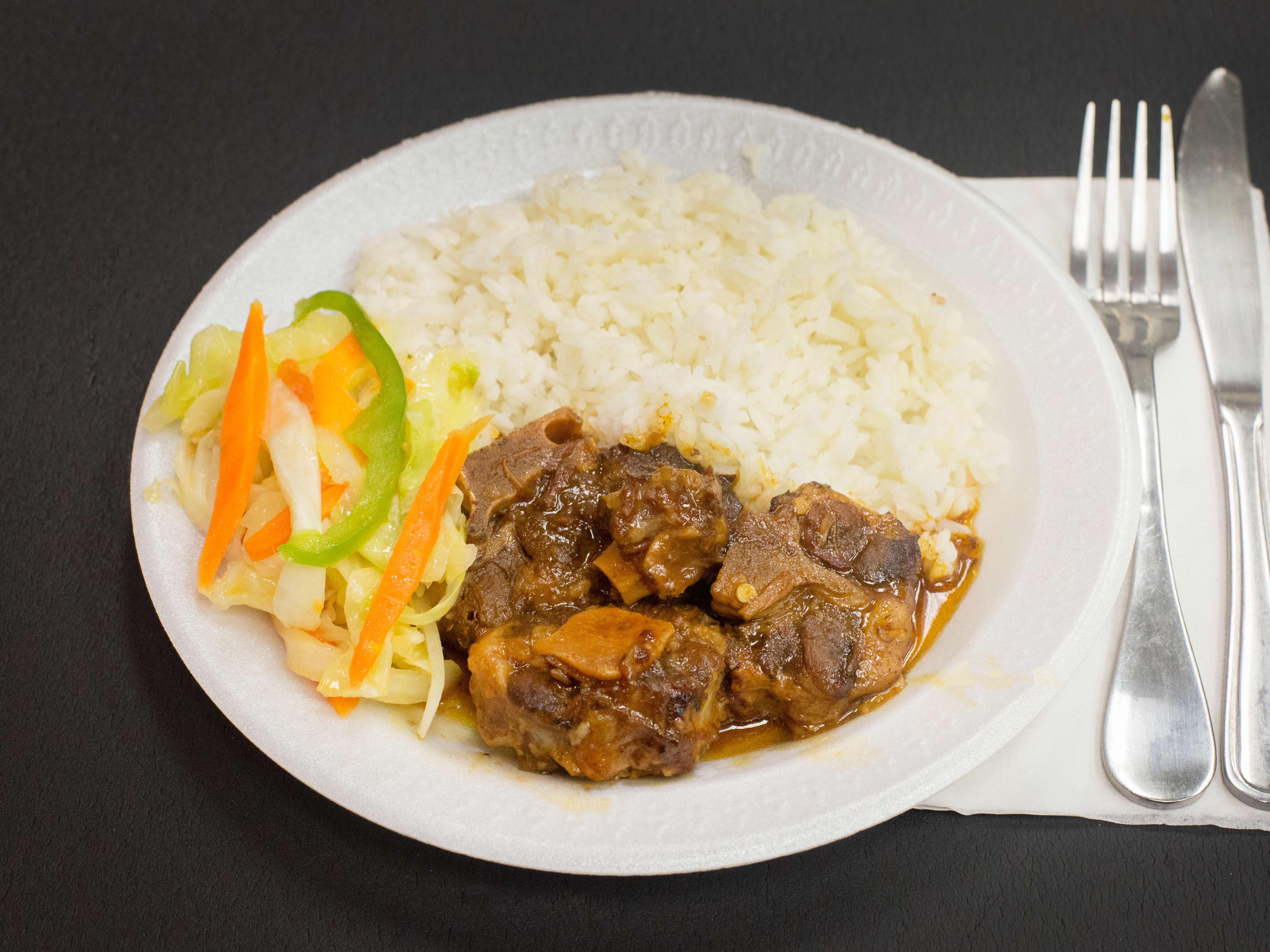 Order Oxtail food online from Family Flamez Restaurant store, Fairfield on bringmethat.com