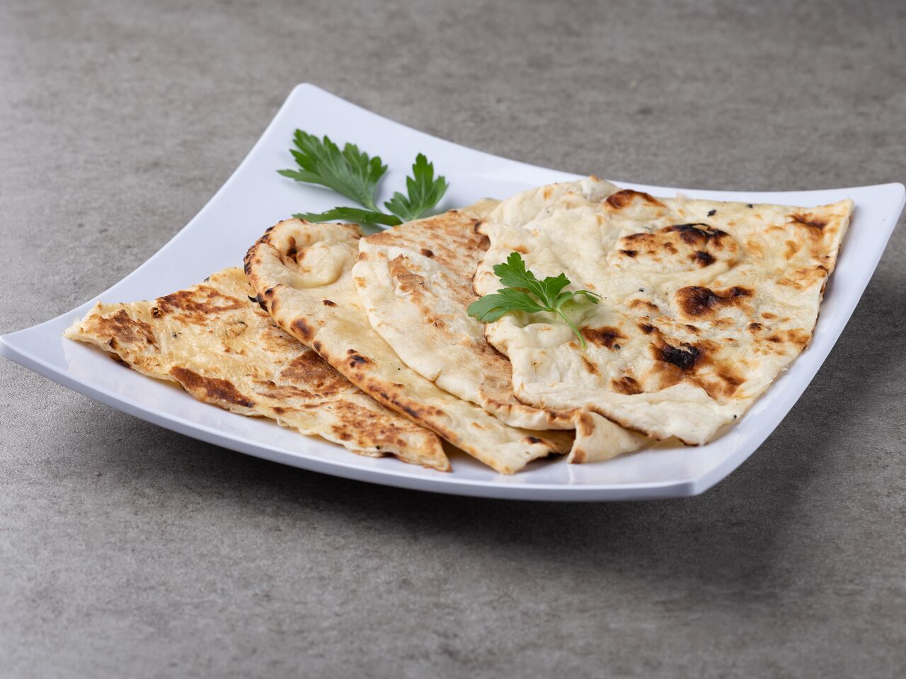 Order 35. Butter Naan food online from Himalayan Restaurant store, San Diego on bringmethat.com