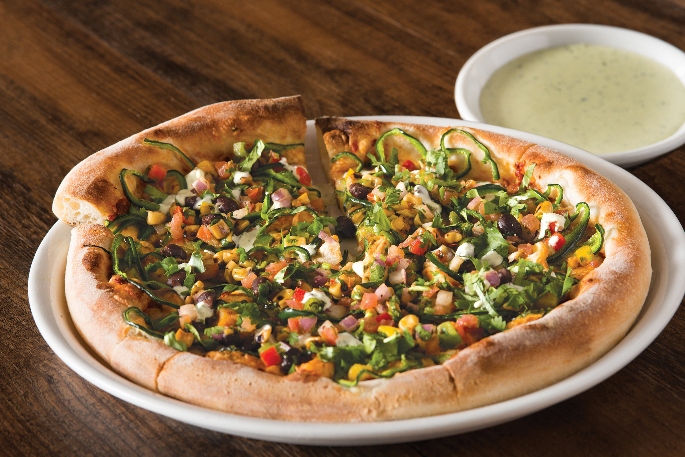 Order Spicy Chipotle Chicken Pizza  food online from California Pizza Kitchen - River City Dr store, Jacksonville on bringmethat.com