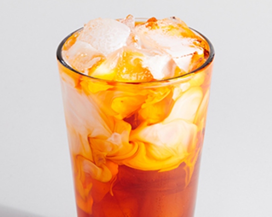 Order Thai Iced Tea (Quad) food online from Sweetwaters Coffee & Tea store, Naperville on bringmethat.com