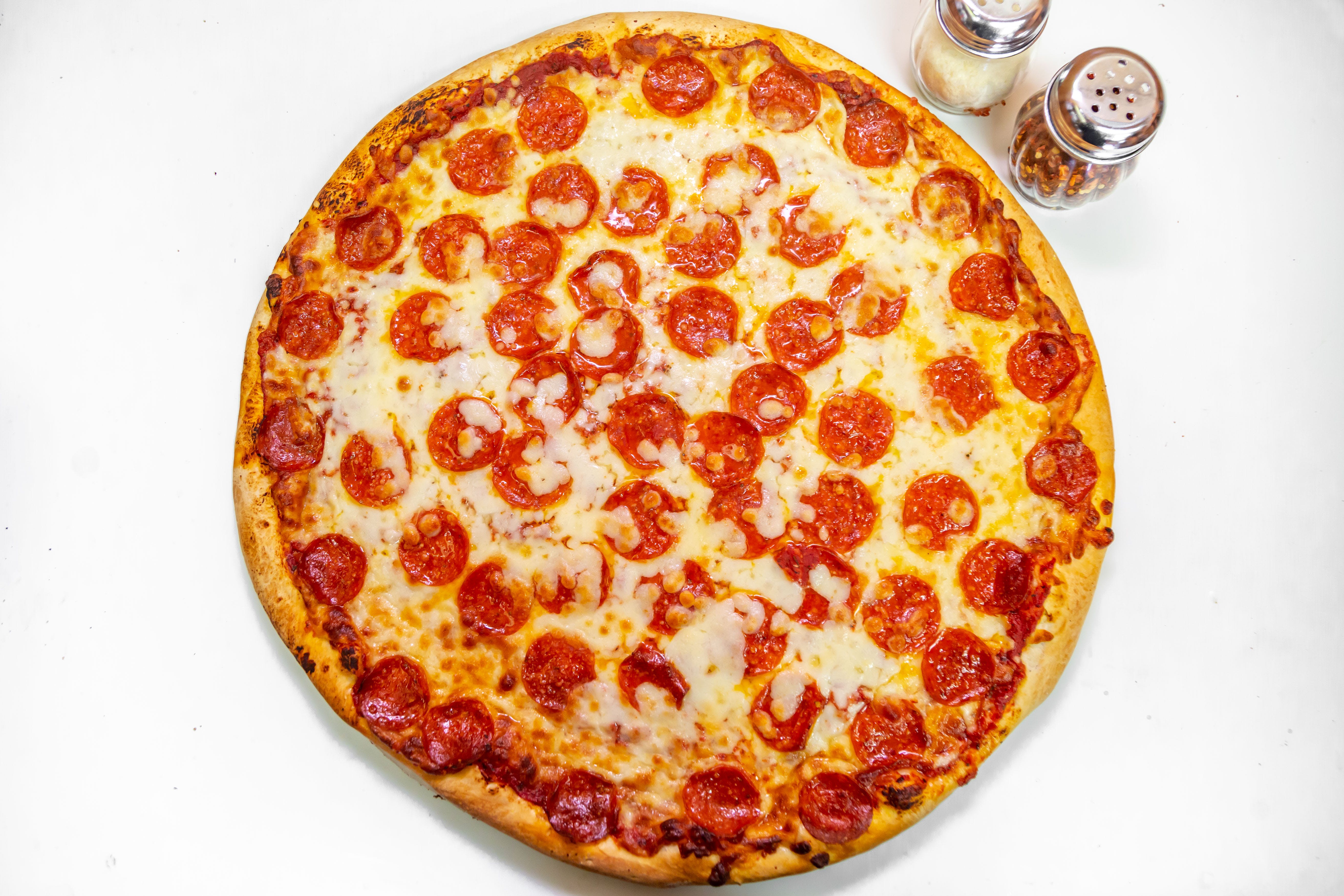 Order Slice of Pepperoni Pizza - Slice food online from Benny's Pizza store, Chicago on bringmethat.com