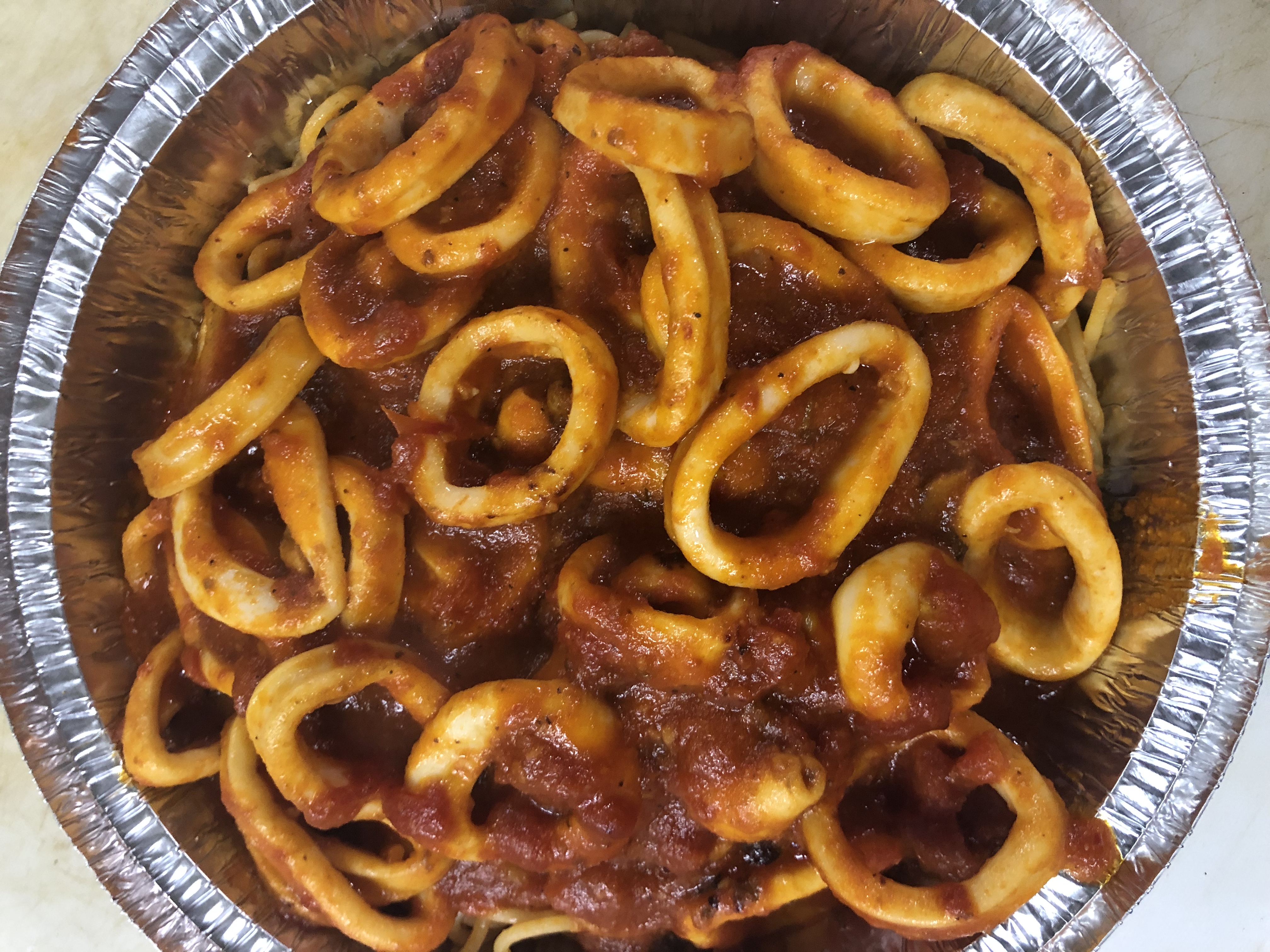 Order Spaghetti Calamari Giardino food online from Toskana Pizzeria Restaurant store, Roslyn Heights on bringmethat.com