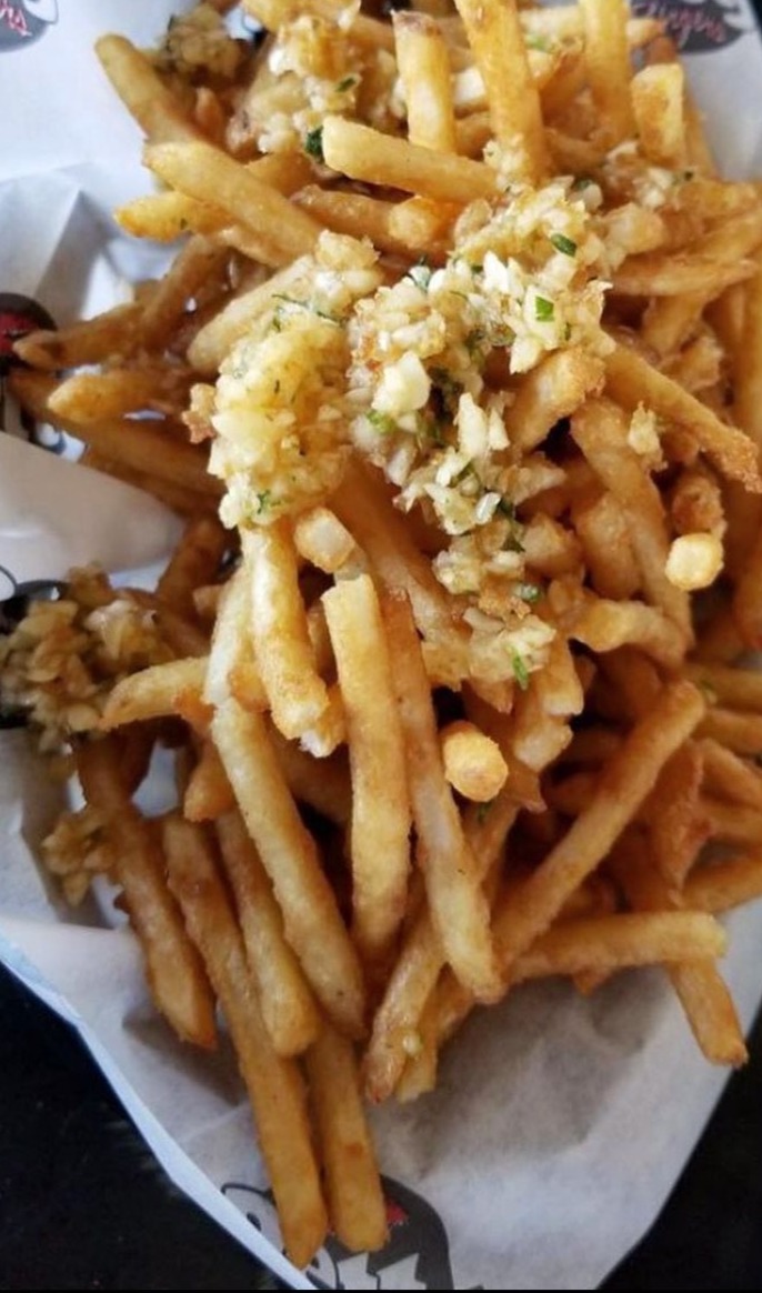Order Garlic Fries - Basket food online from Betty Burgers store, Aptos on bringmethat.com