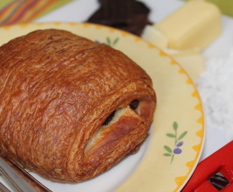 Order Organic French Chocolate Croissant food online from St. Roger Abbey Organic French Gourmet Patisserie store, Wilmette on bringmethat.com