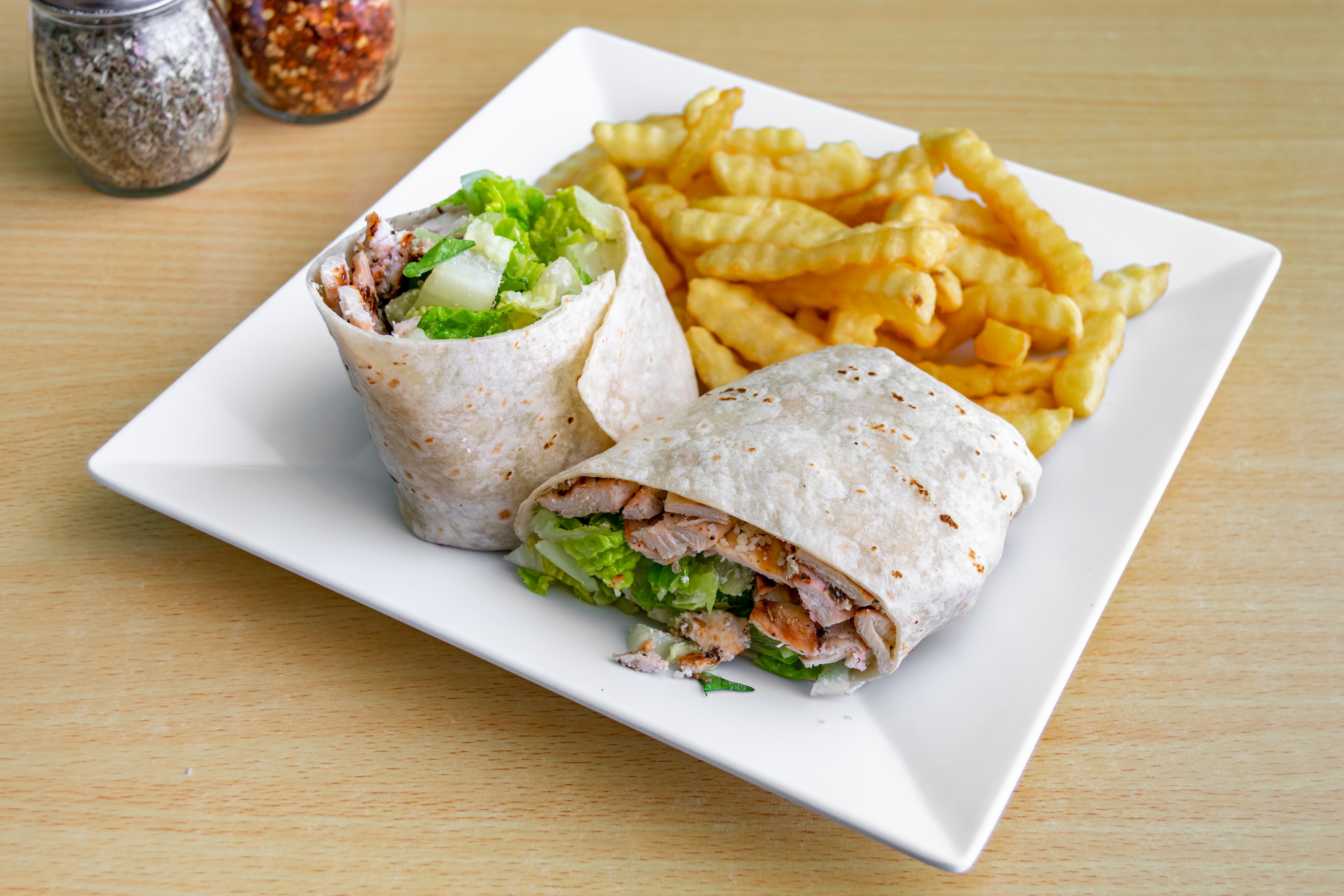 Order Grilled Chicken Caesar Wrap - Wrap food online from Dolce Pizza store, East Orange on bringmethat.com