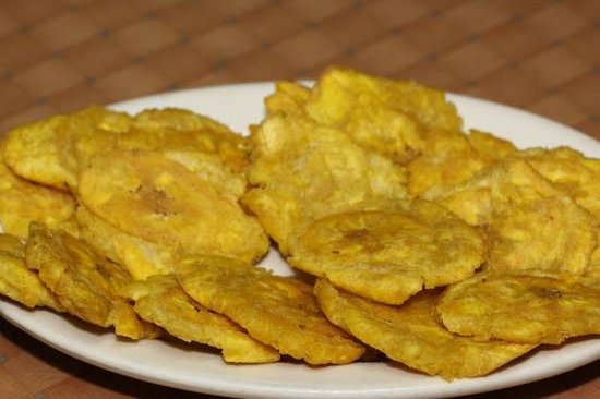 Order Fried Smashed Plantains / Tostones food online from La barca restaurant store, New York on bringmethat.com