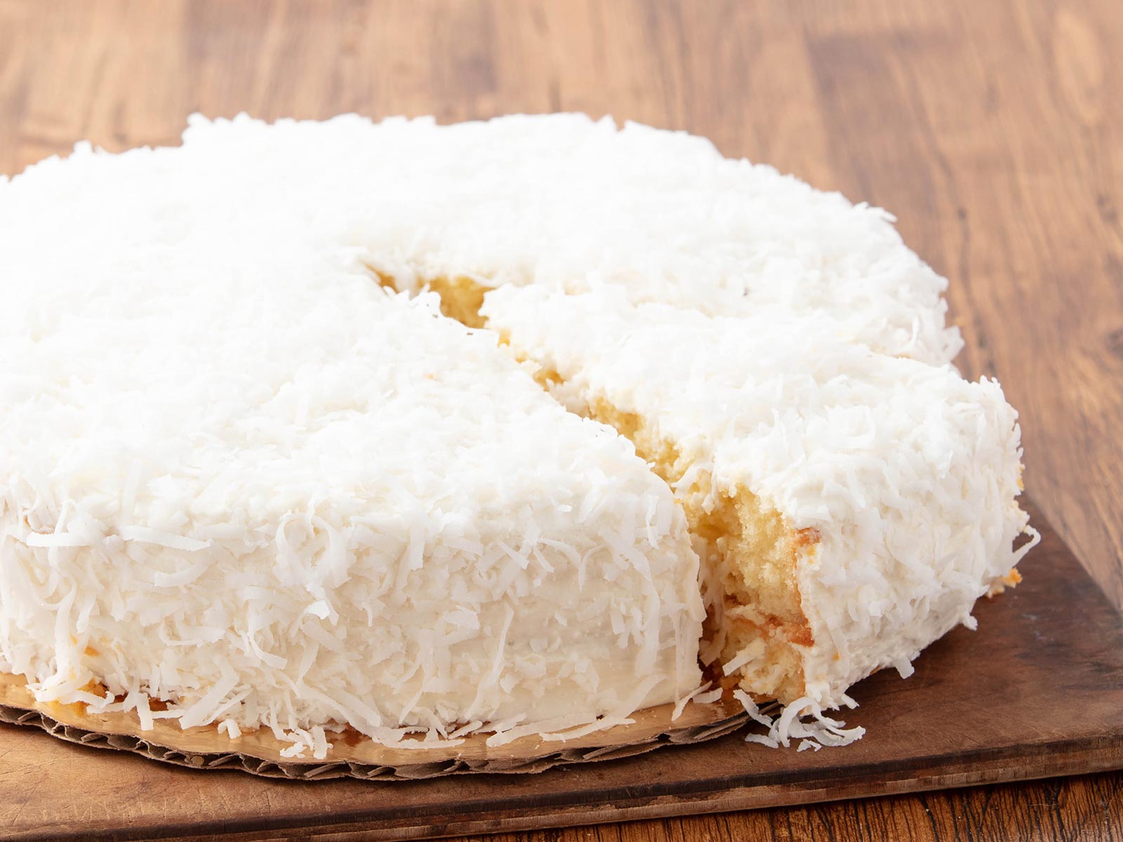 Order Coconut Cream Cake - Whole food online from La Madeleine French Bakery & Cafe store, Dallas on bringmethat.com