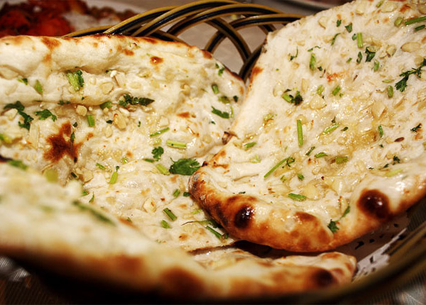 Order Garlic Basil Naan food online from Biryani Xprx store, Harrison on bringmethat.com