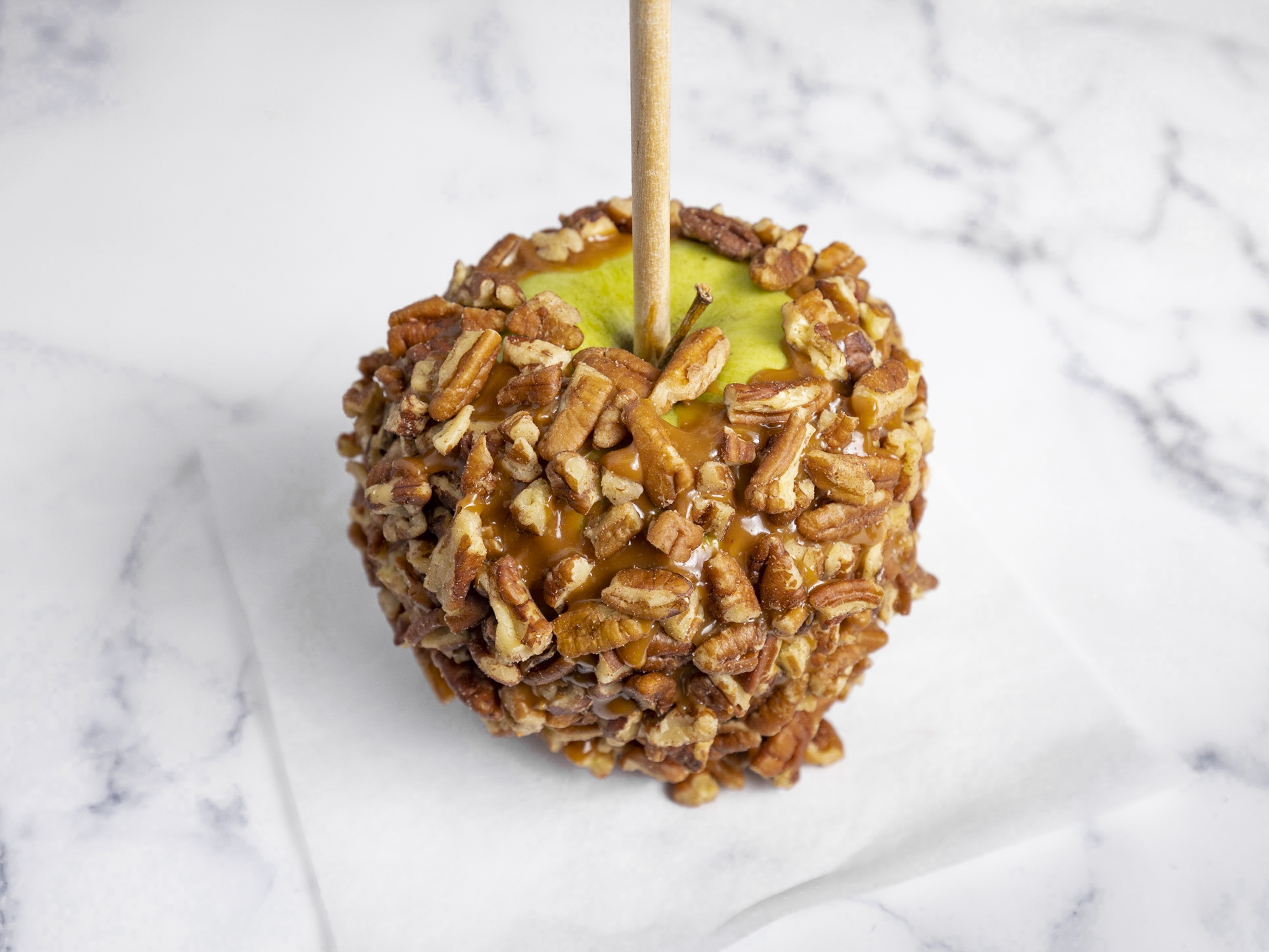 Order Caramel Apple with Pecan food online from San Francisco Chocolate Store store, San Francisco on bringmethat.com