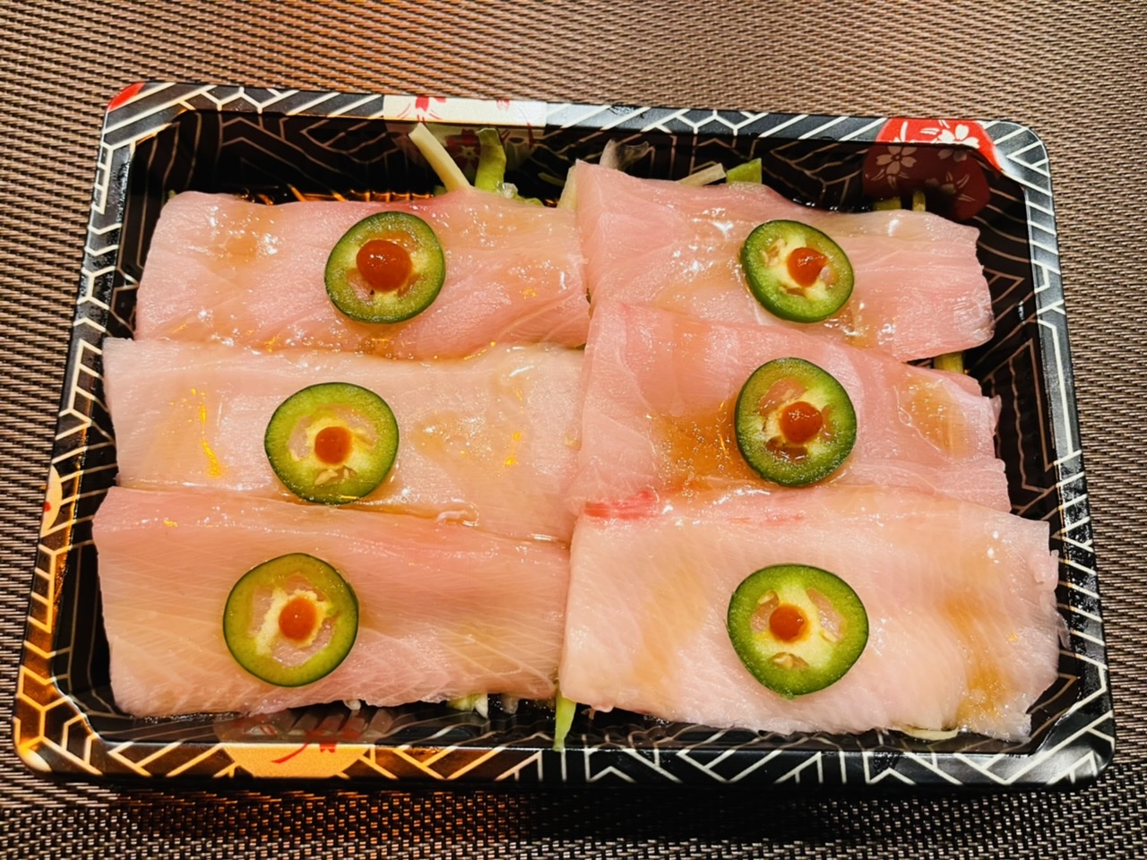 Order 6. Yellowtail Jalapeno(APP) food online from Tomodachi Japanese Steakhouse & Sushi Bar store, Royersford on bringmethat.com