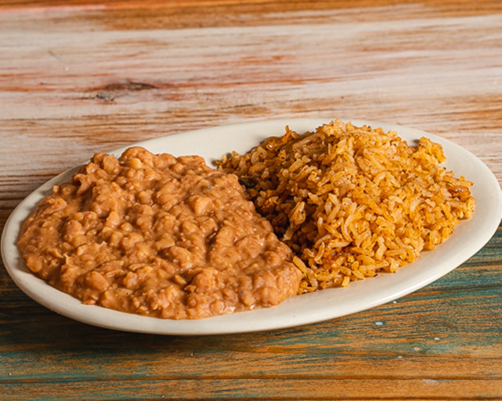 Order Rice and Refried Beans food online from Fajita Willie store, Houston on bringmethat.com
