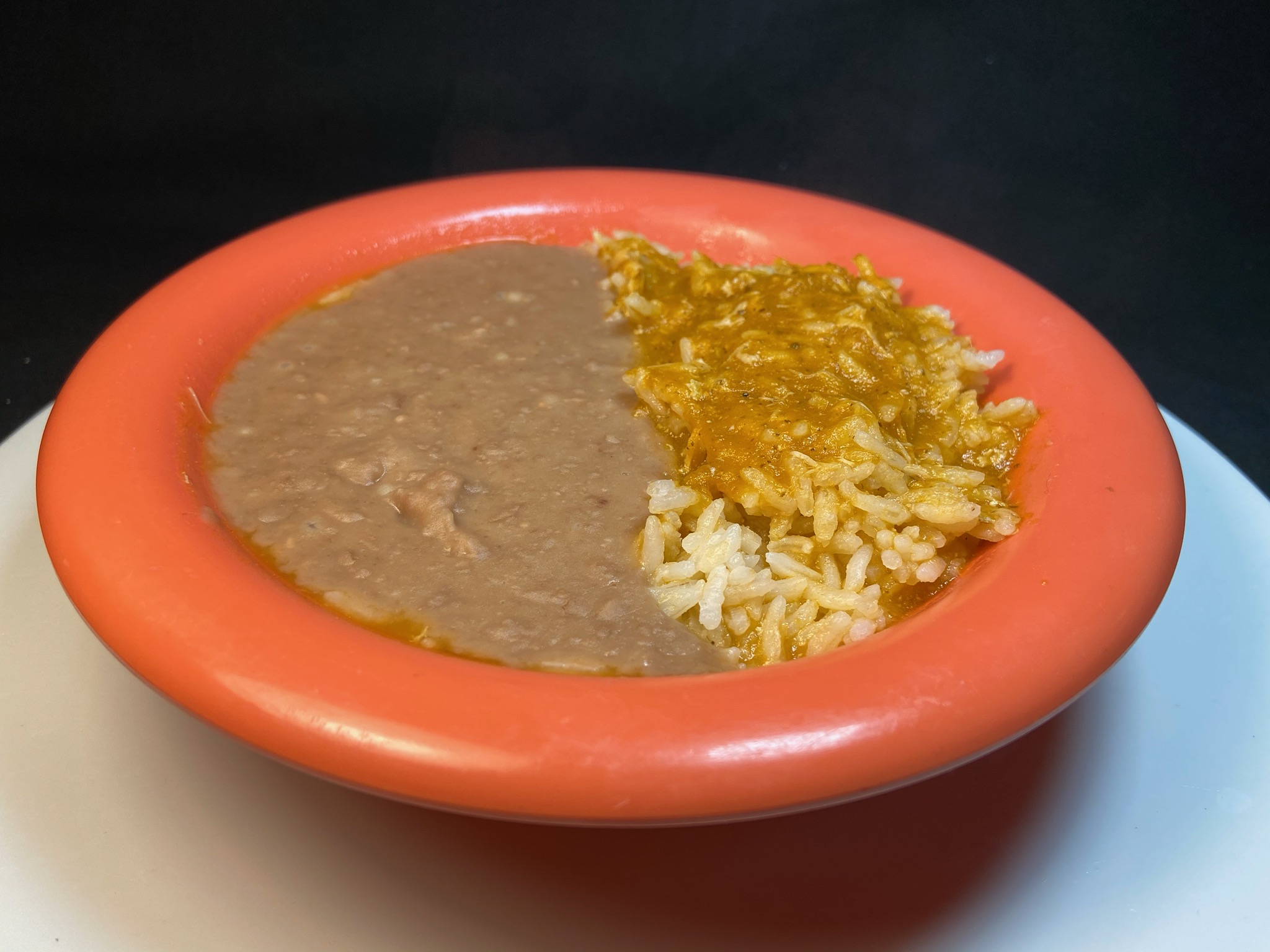 Order 12 oz. Bowl of Rice and Beans food online from Adelita Taqueria Restaurant & Bar store, San Jose on bringmethat.com