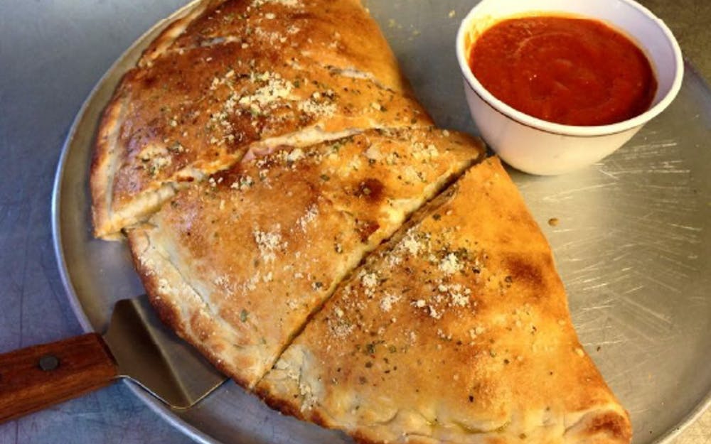 Order New York Calzone - Calzone food online from New York Pizzeria store, Houston on bringmethat.com