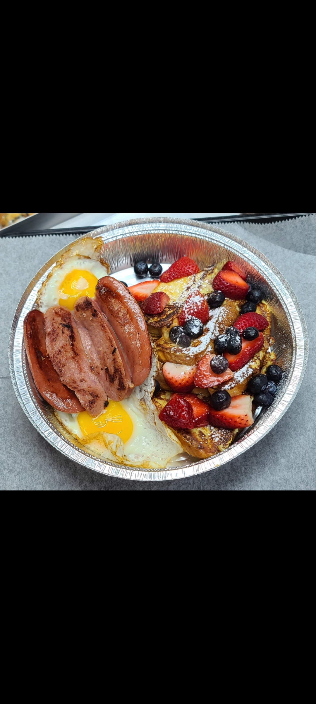 Order Eggs French Toast Blueberries Strawberries & Your Choice Meat food online from American Gourmet Foods Deli store, New York on bringmethat.com