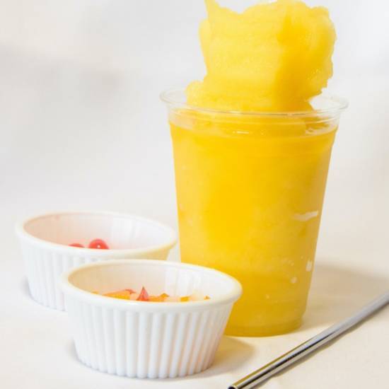 Order Mango Slush food online from Trinitea Tea store, San Diego on bringmethat.com
