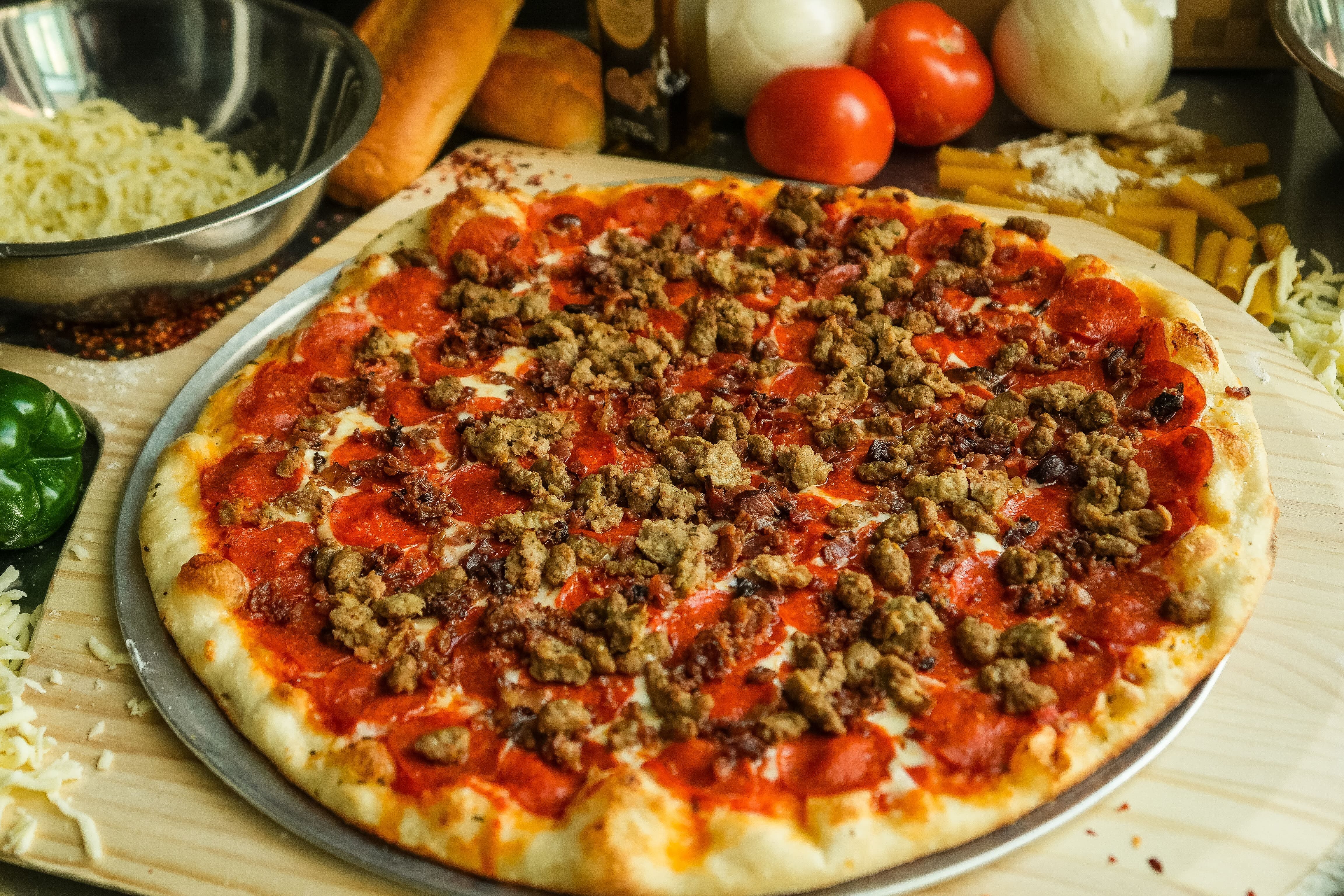 Order Carnivore Pizza - 18" food online from Sarpino's Pizzeria Buckhead store, Atlanta on bringmethat.com