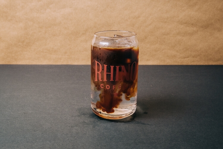 Order Iced Americano food online from Rhino Coffee Downtown store, Shreveport on bringmethat.com