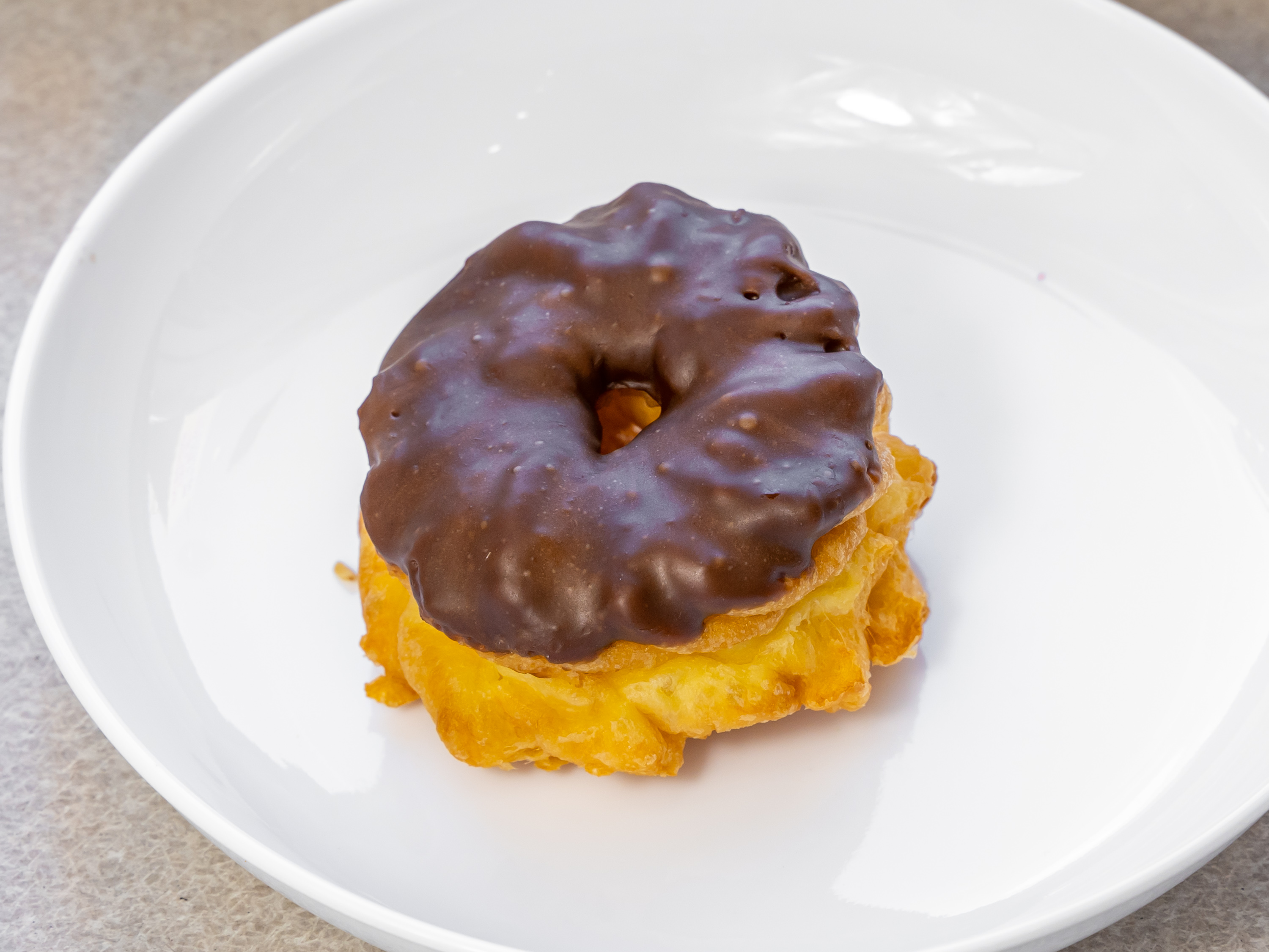 Order Chocolate French Cruller food online from Glaze Donuts And Bagel Sandwiches store, San Francisco on bringmethat.com