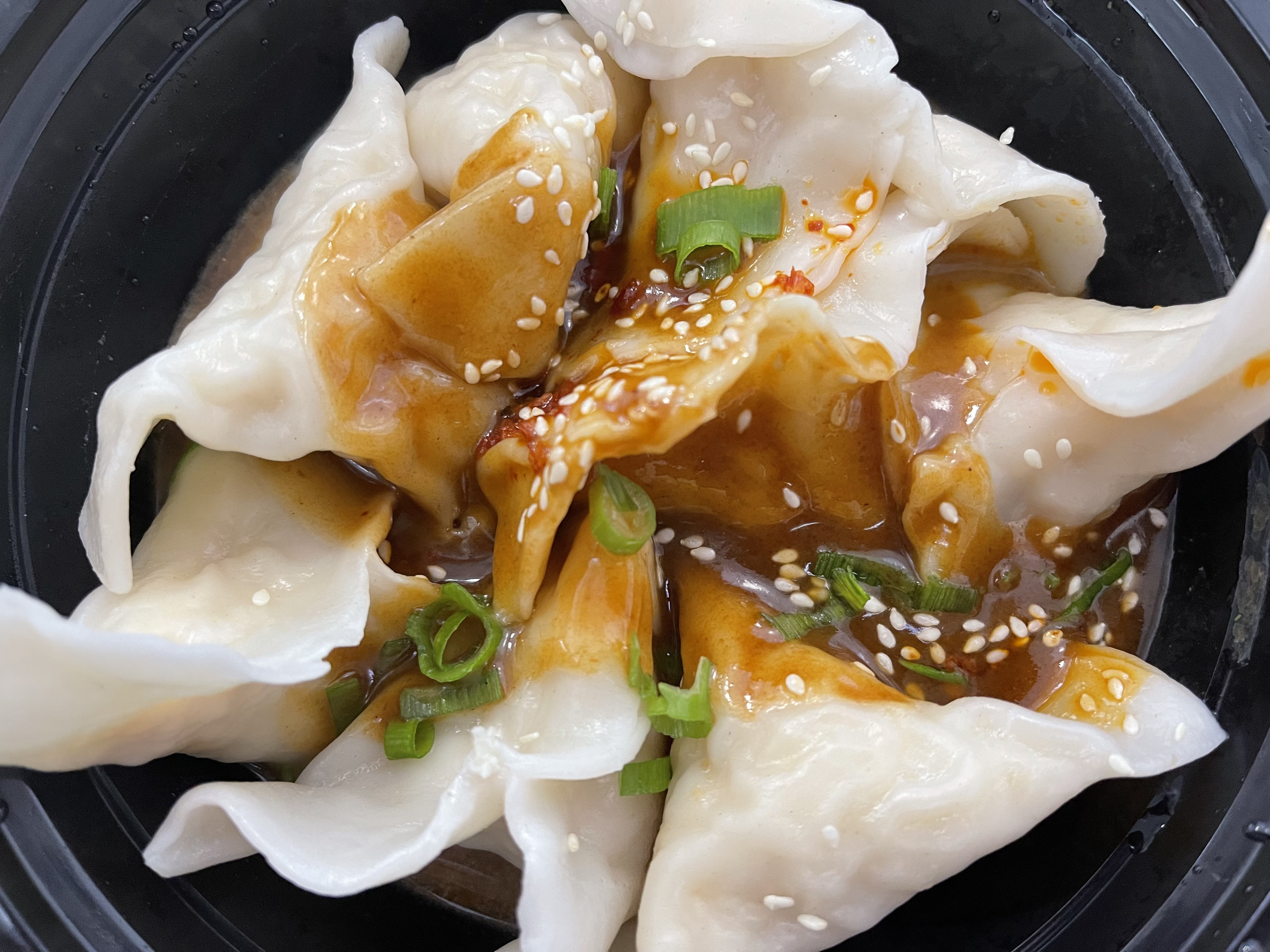 Order 148. 8 Piece Chicken Dumplings in Hot Sesame Sauce food online from Yum Yum Chinese & Pan Asian Cuisine store, Staten Island on bringmethat.com