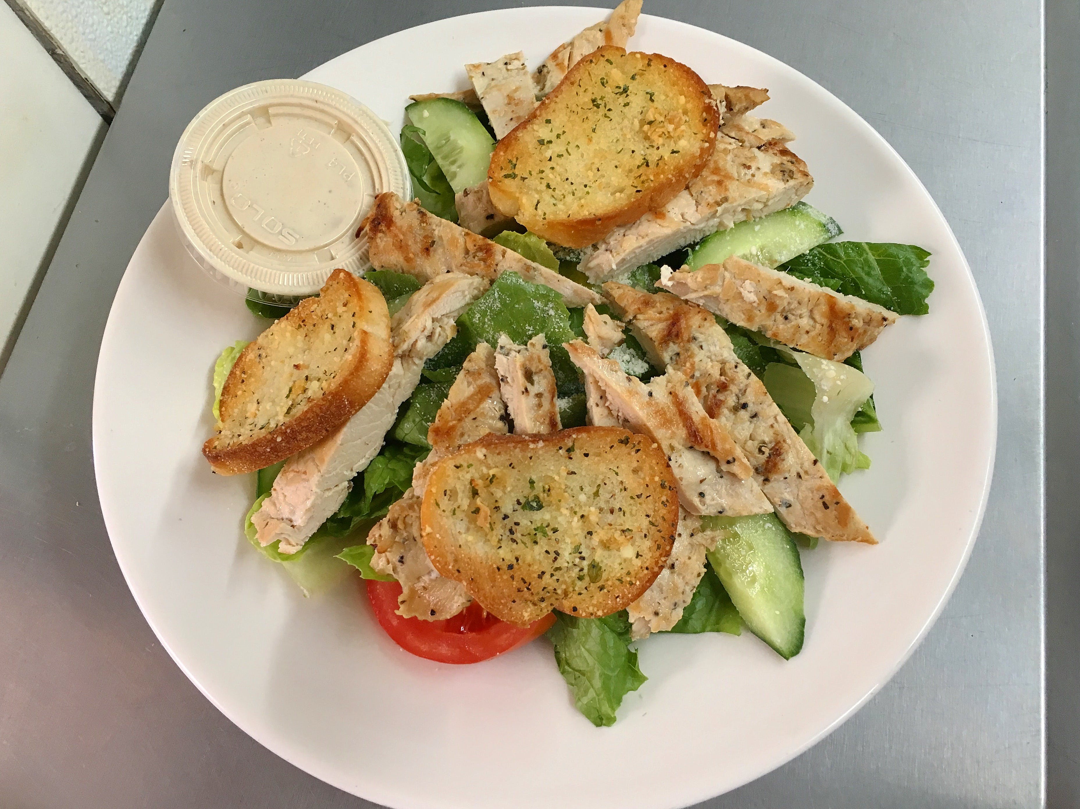 Order Chicken Caesar Salad - Salad food online from Gaby's Pizza & Grill store, Saddle Brook on bringmethat.com