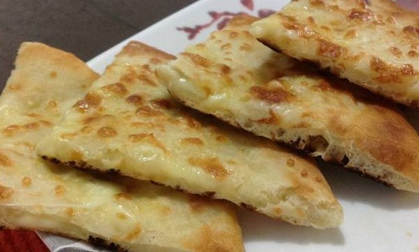 Order Cheese Naan food online from Himalayan Yak & Yeti store, San Diego on bringmethat.com