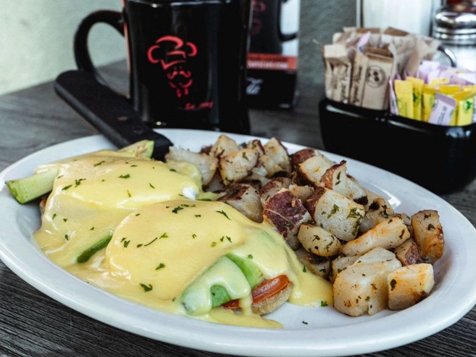 Order Avocado Benedict - OO food online from Biscuits Cafe store, Chandler on bringmethat.com
