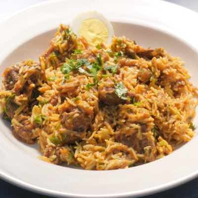 Order LAMB BIRYANI (63) food online from Kabob & Curry store, Providence on bringmethat.com